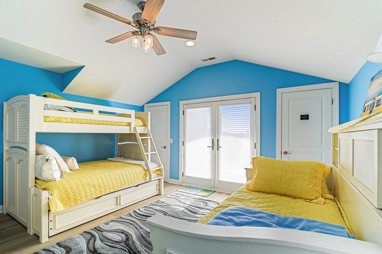 Sleep soundly in this cheerful room with cozy bunk beds and plenty of space for the whole family to relax together.