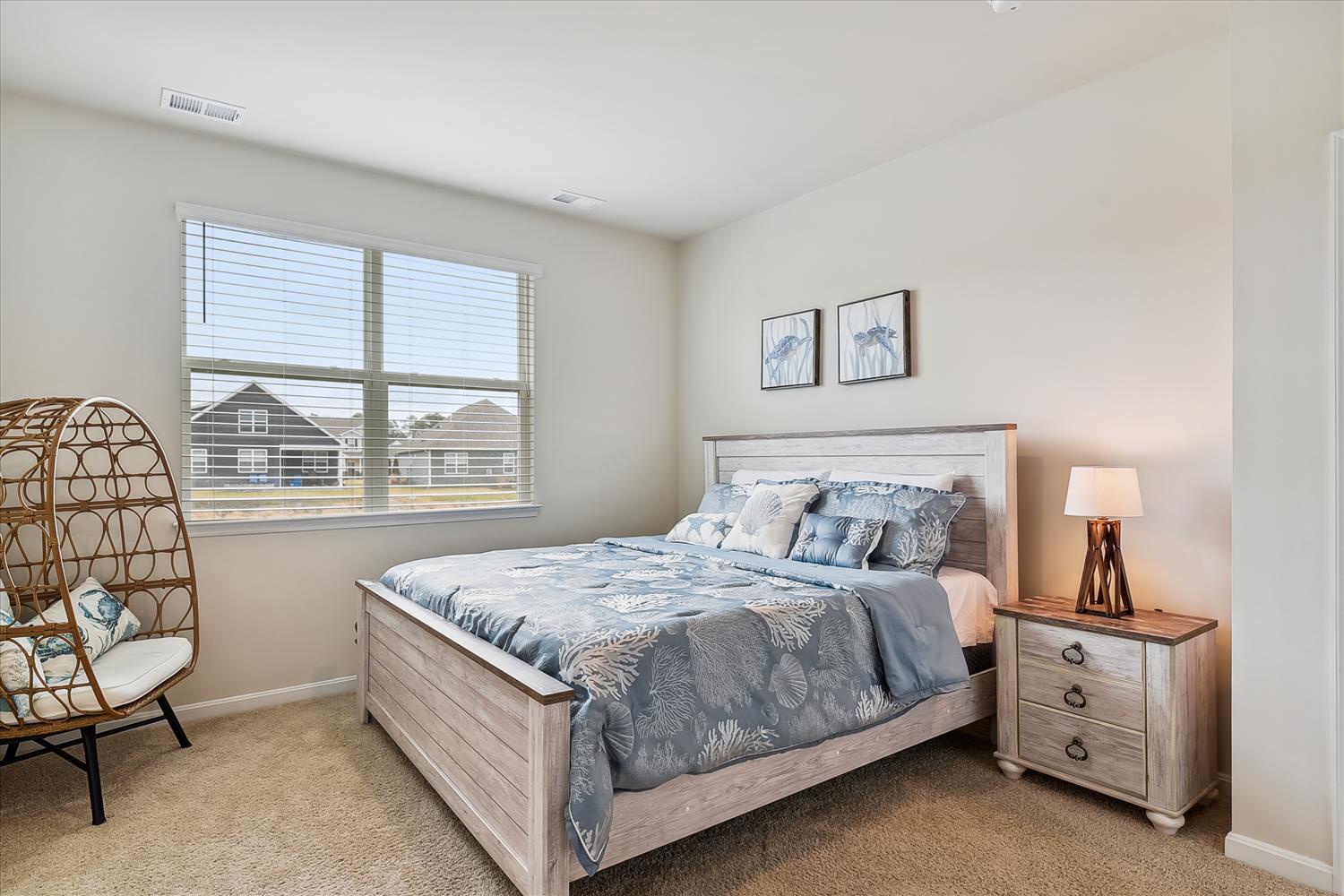 Sink into comfort in your serene bedroom, where soft coastal linens and warm lighting create the perfect retreat for restful nights.