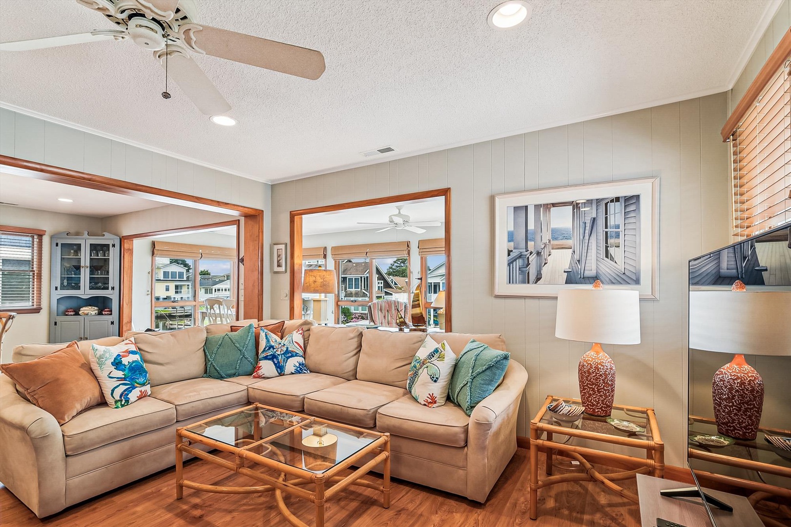 Sink into plush seating in your coastal-chic living room, where natural light streams through elegant windows and ocean-inspired accents invite you to unwind in style.