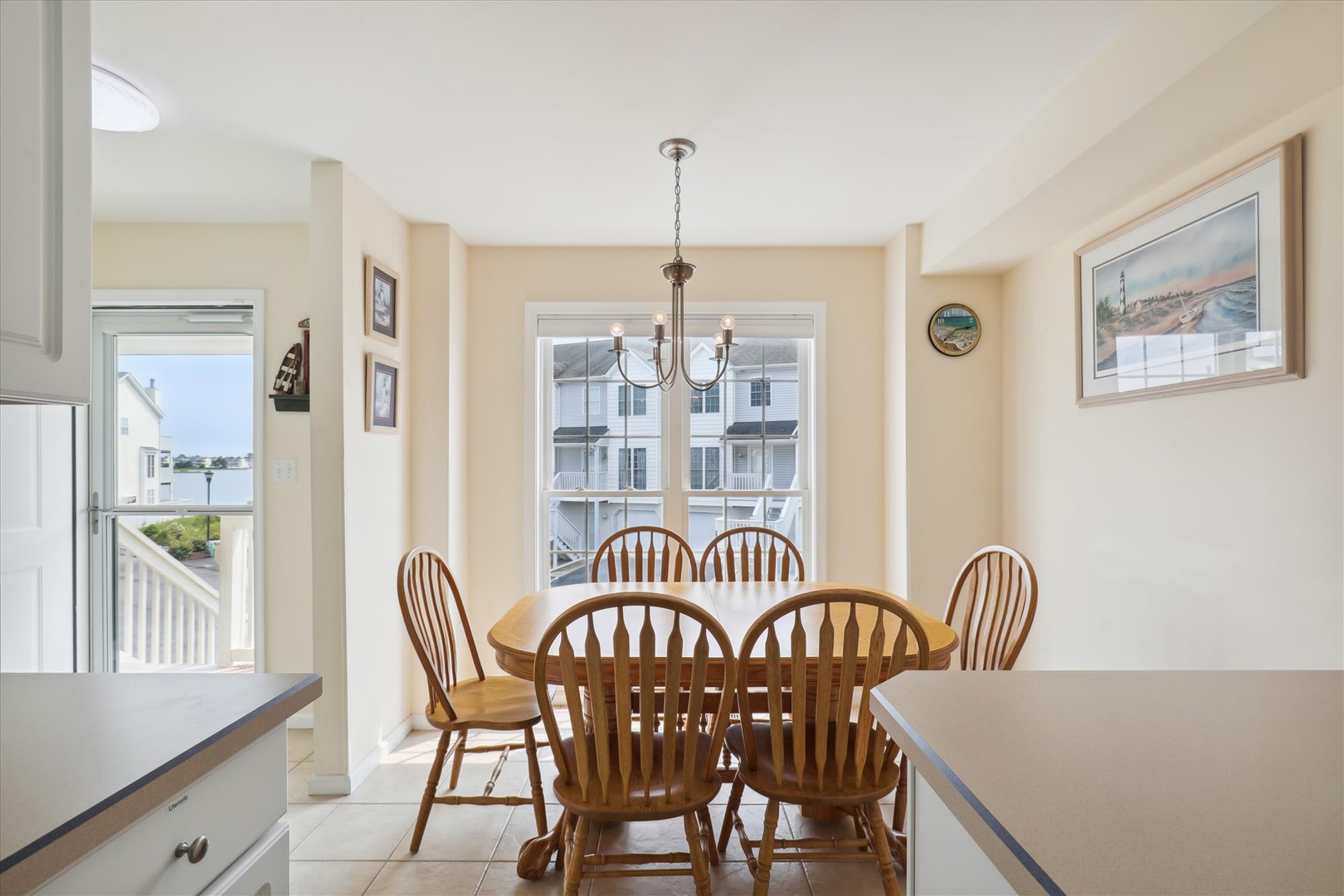 Gather around this inviting dining space where warm tones and natural light create the perfect setting for your morning coffee or evening meals together.