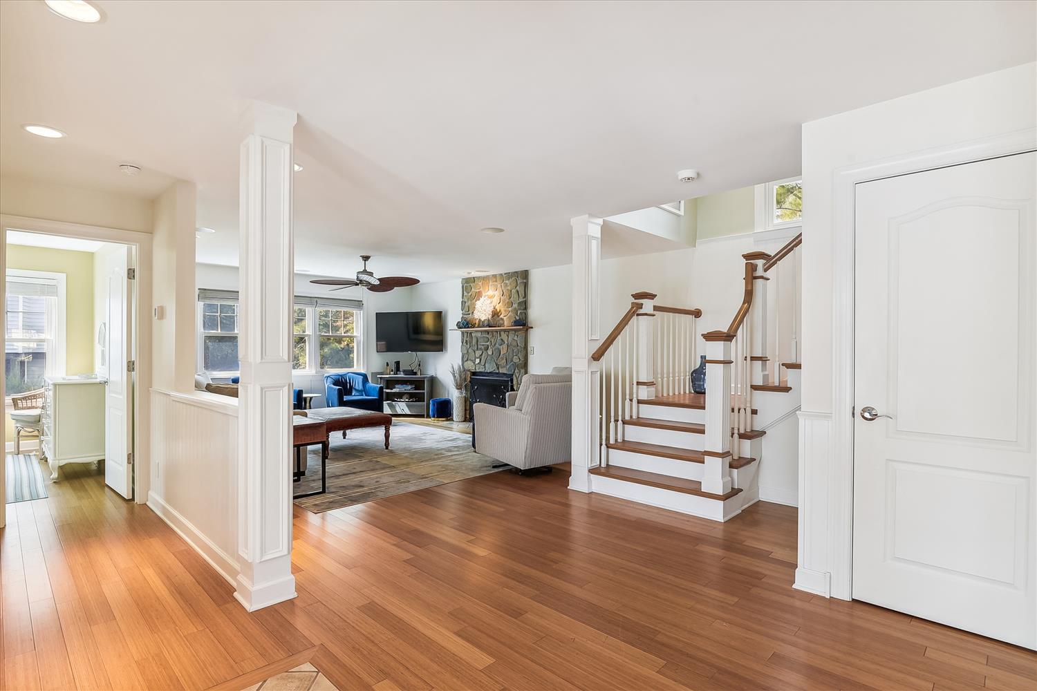 Step inside your stylish retreat, where warm hardwood flows through open, light-filled spaces. Relax by the cozy fireplace or unwind upstairs—your home away from home awaits.