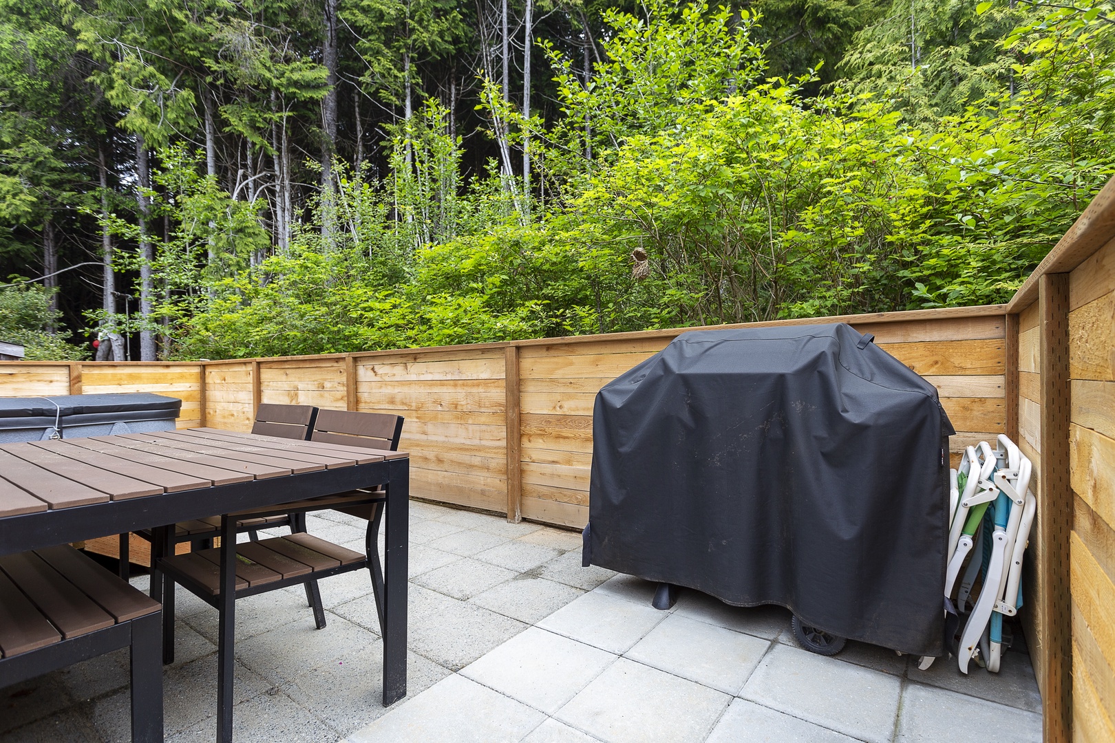 Private back patio with bbq hot tub and outdoor seating