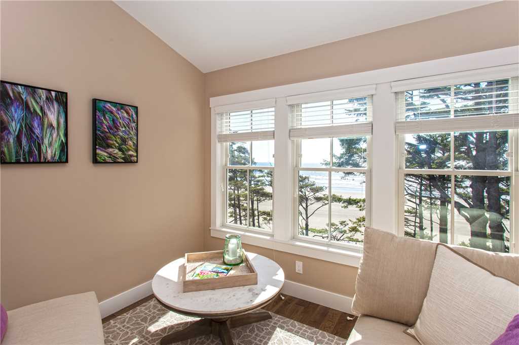 Sitting room and view of ocean, upstairs primary right king bedroom