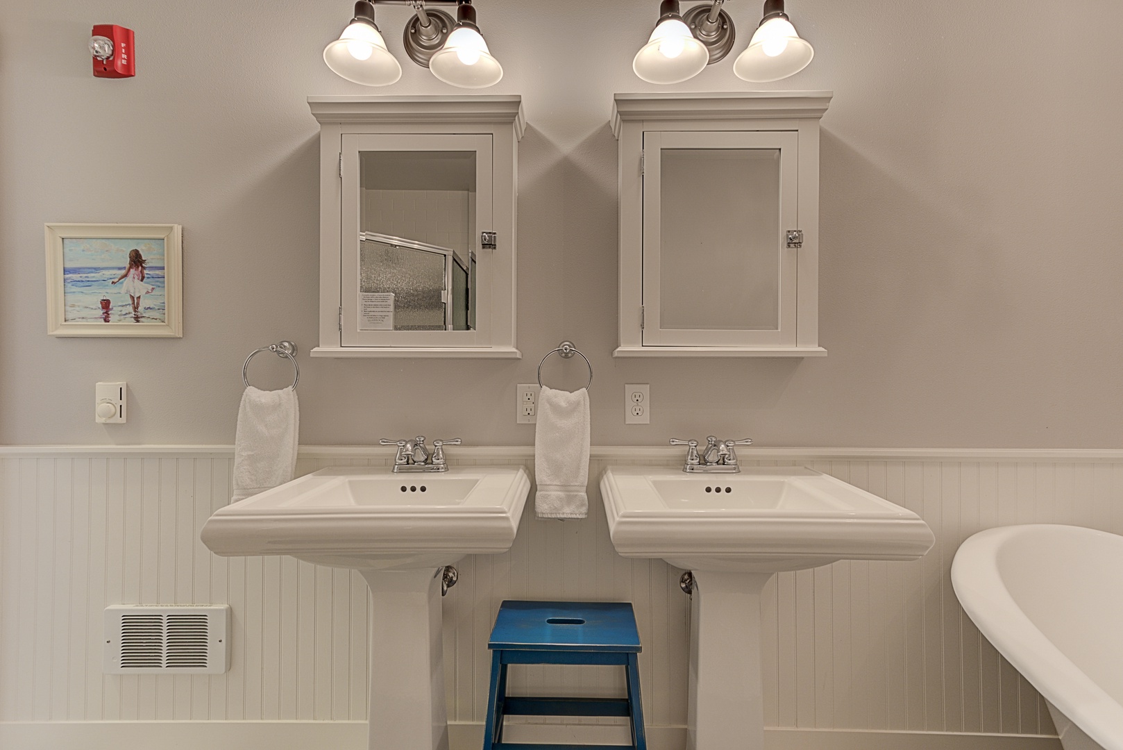 Private bathroom with his and hers vanity, large Clawfoot soaking tub and separate shower