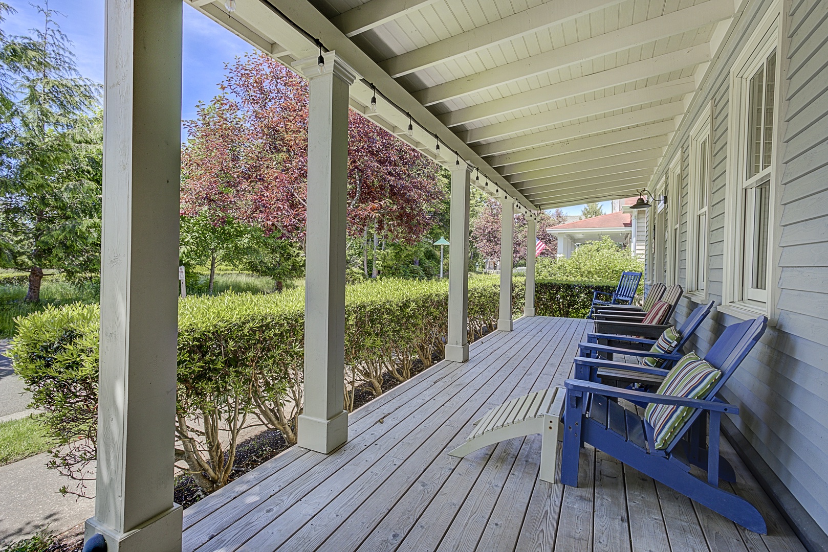 Covered front porch with view of Crescent Park