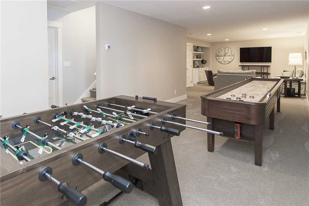 Lower level media room with shuffleboard and foosball