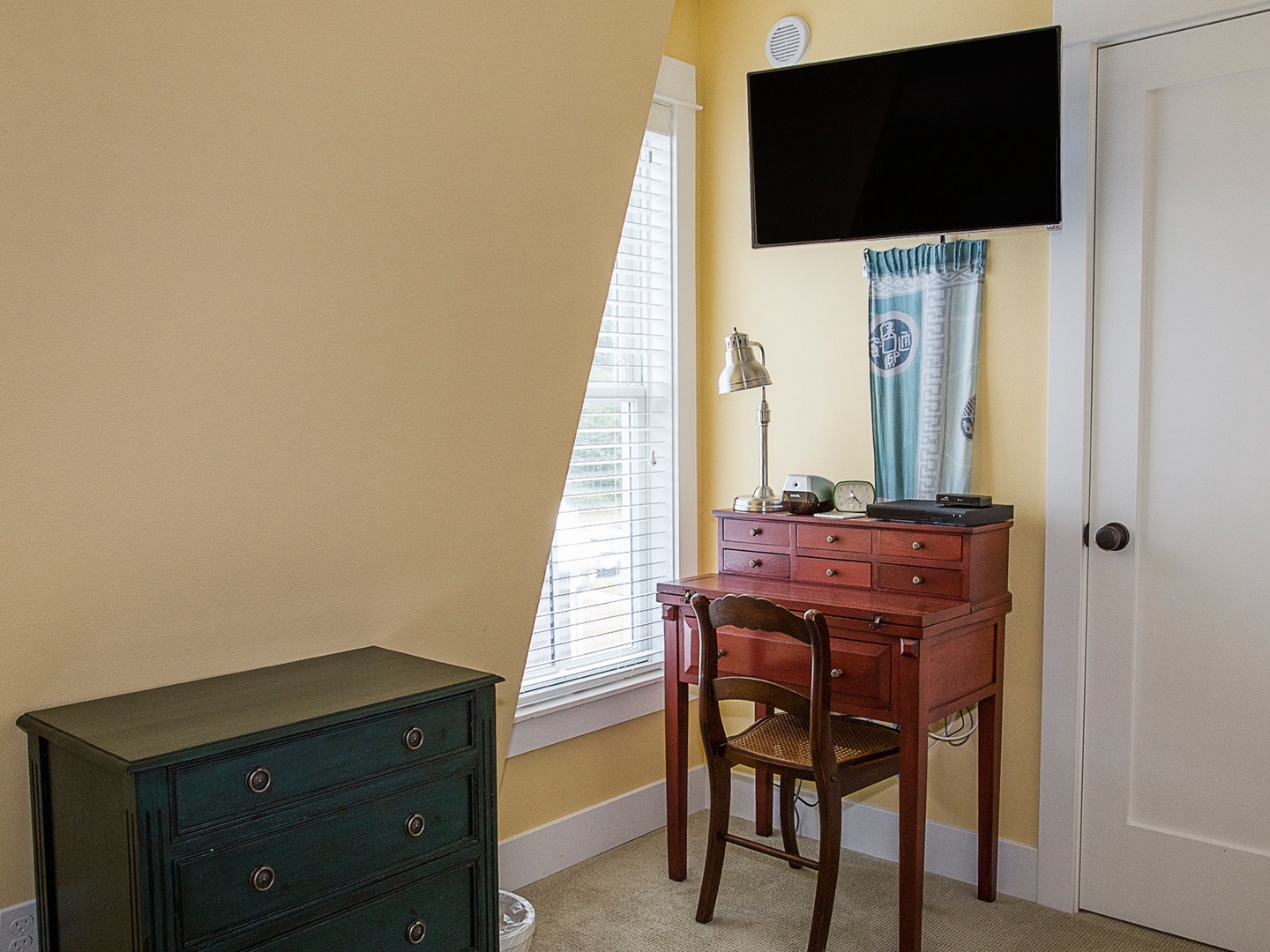 Flat screen TV in Queen bedroom