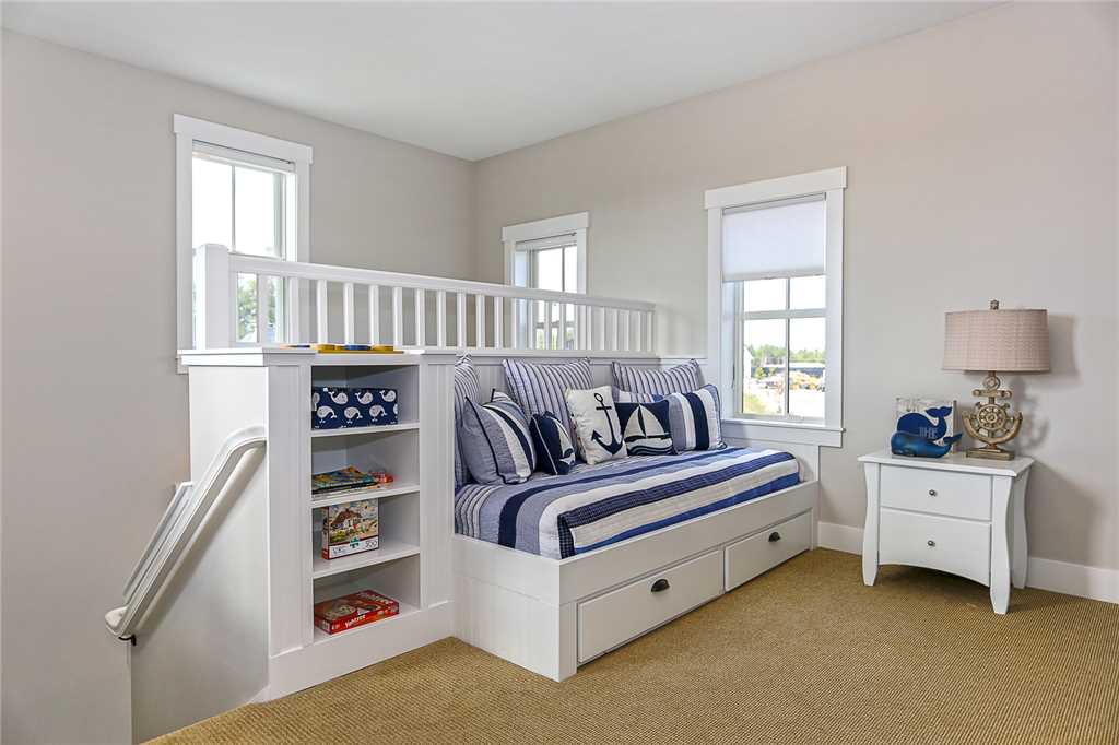Moving upstairs you'll find a great flex space at the main landing with a built in daybed