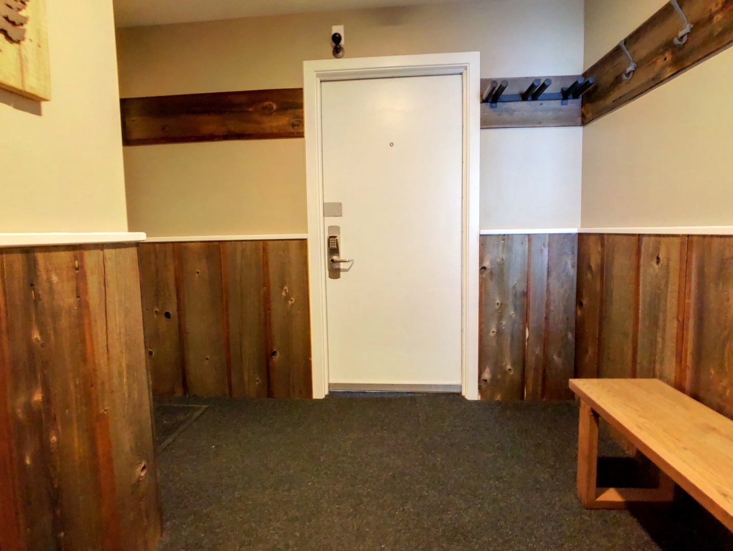 Entryway with ski storage, bench and coat hooks