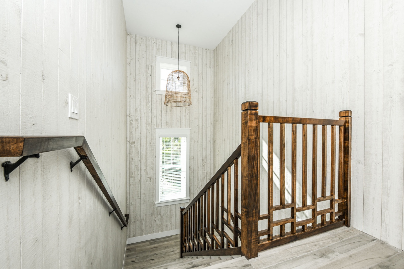 Beautiful wooden staircase leading to the 2nd floor