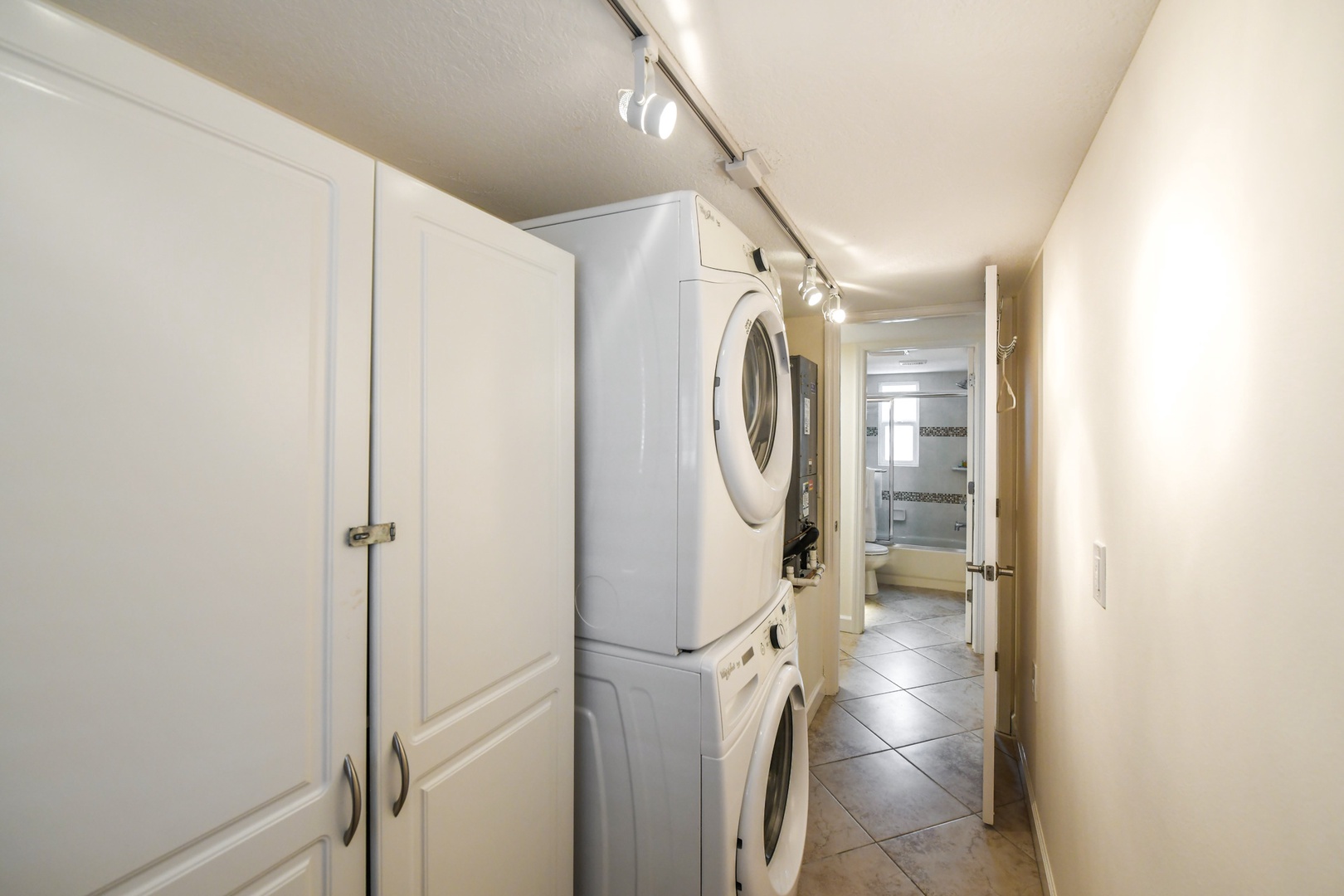 Utility Closet with full size stackable washer and dryer