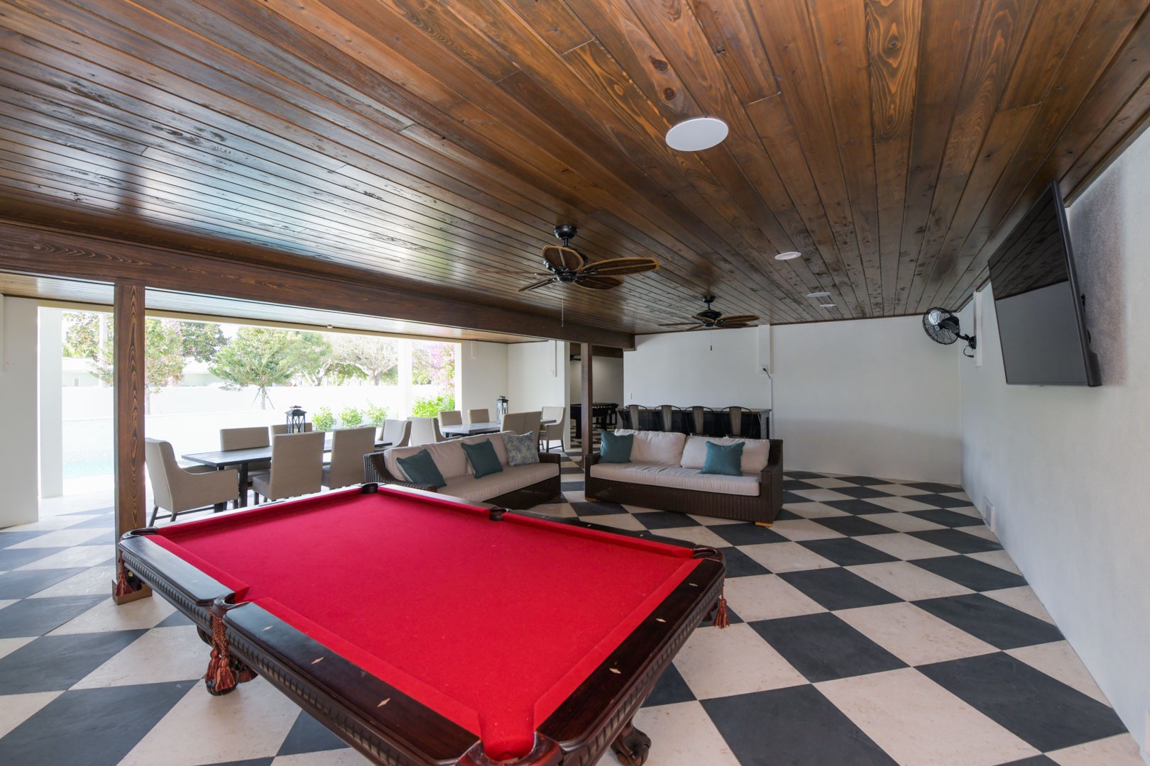 Pool table and lounge area by the pool