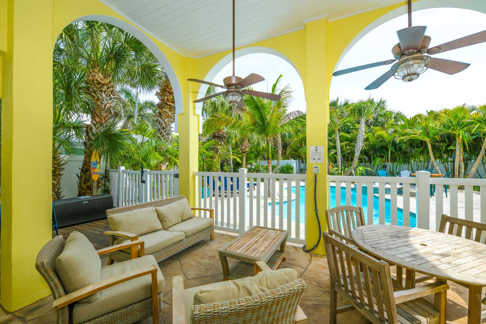 Private Covered Seating. Fence between Patio and Pool