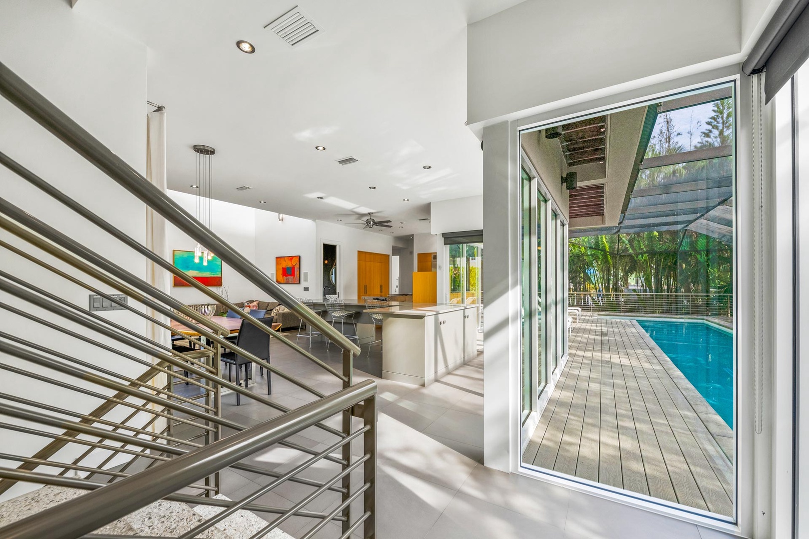 Staircase to Main Living Area - Glass Sliding Doors to Pool