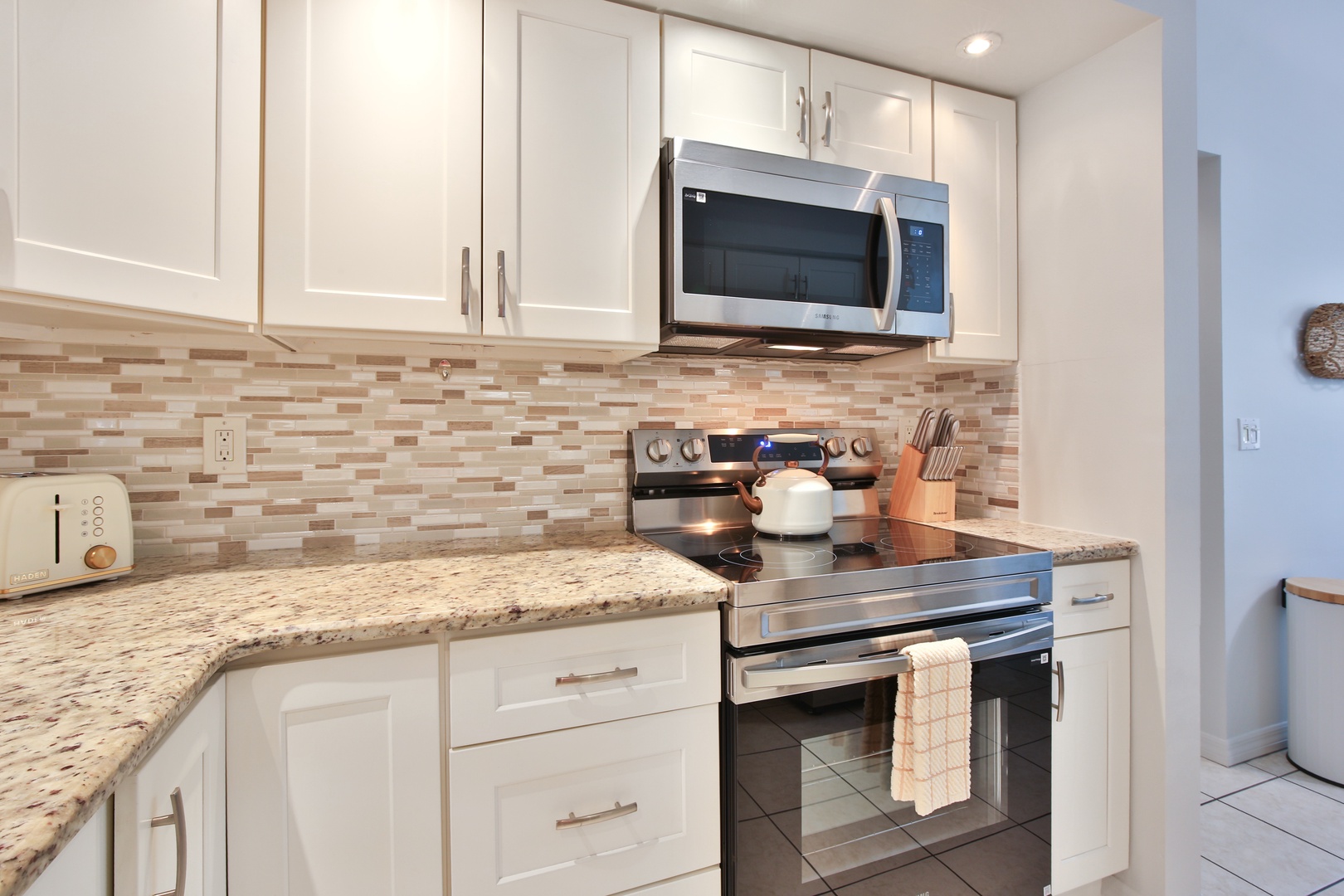 Your fully equipped kitchen features granite countertops, modern appliances, and everything you need to create memorable meals during your stay.
