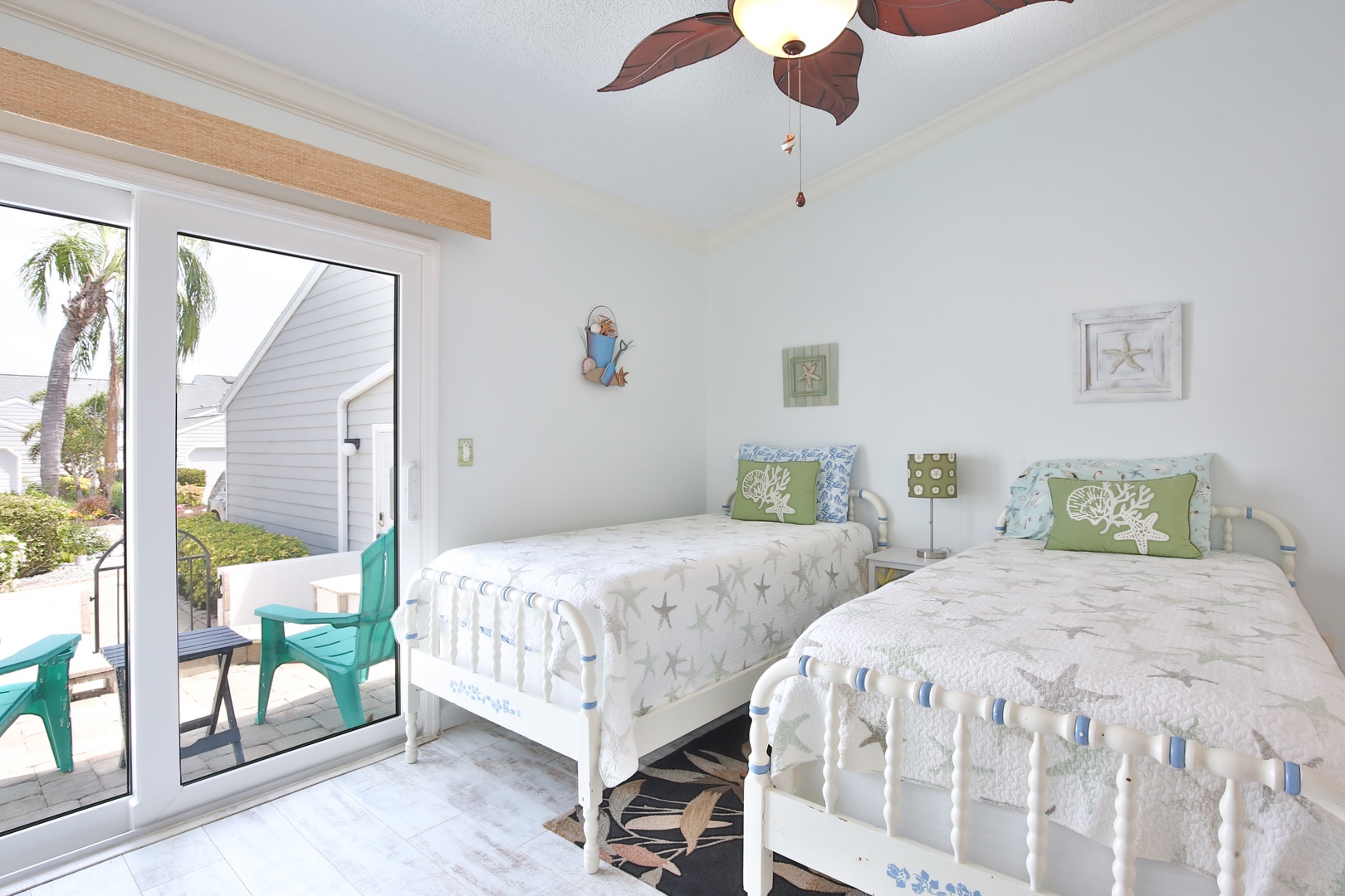 Drift off to sleep in this serene coastal bedroom with two comfy beds, where gentle ocean breezes and beach-inspired decor create your perfect seaside sanctuary.