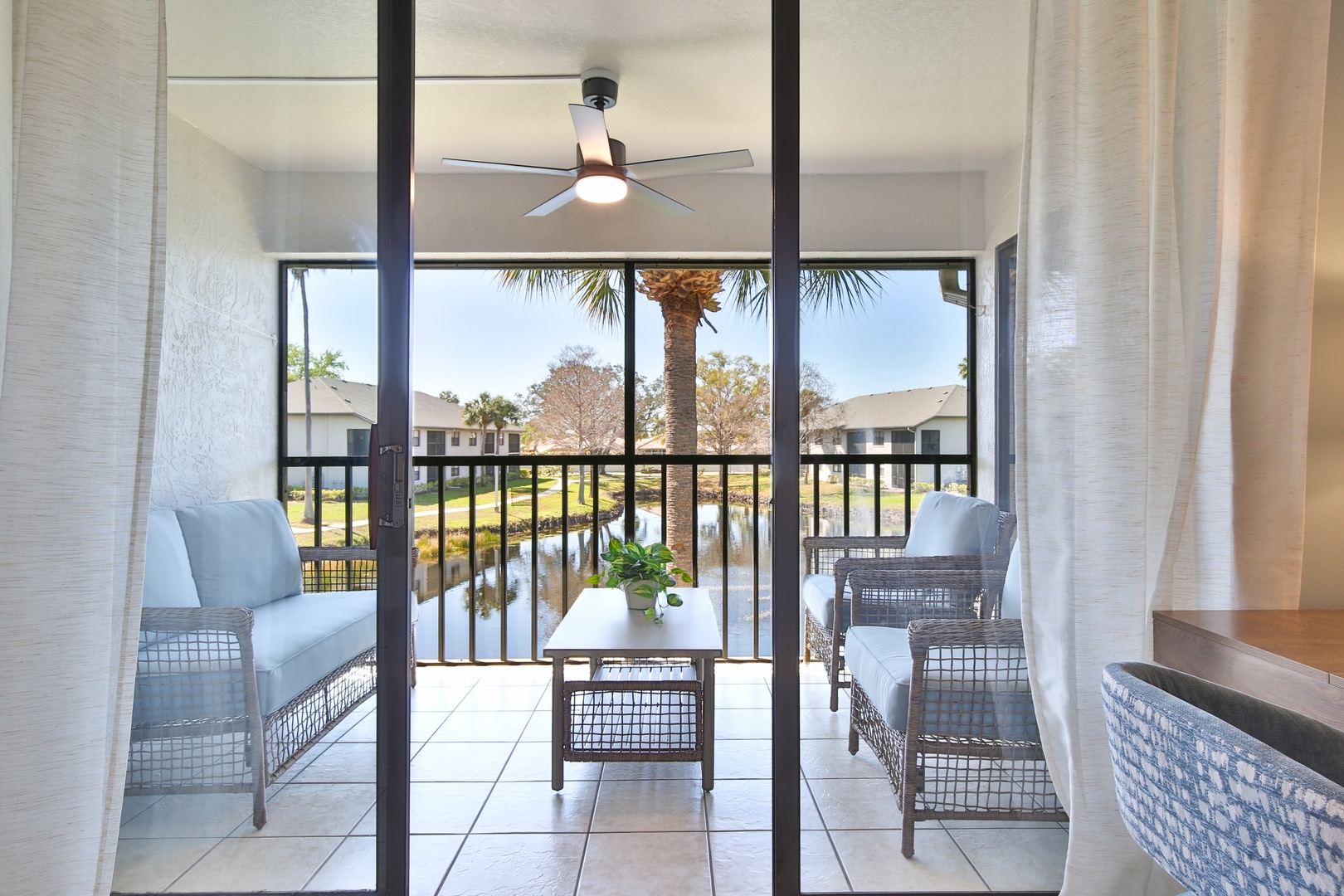 Step onto your private balcony where comfortable wicker chairs invite you to unwind with serene water views.