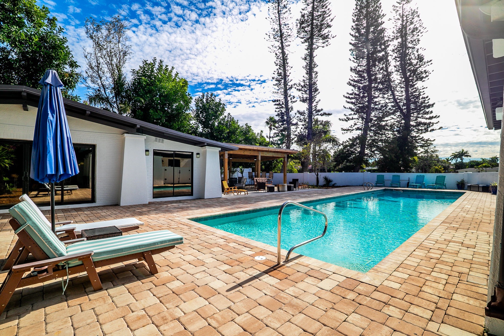 Your private pool paradise awaits with crystal-clear waters, comfortable loungers, and tropical landscaping creating the perfect backyard retreat.