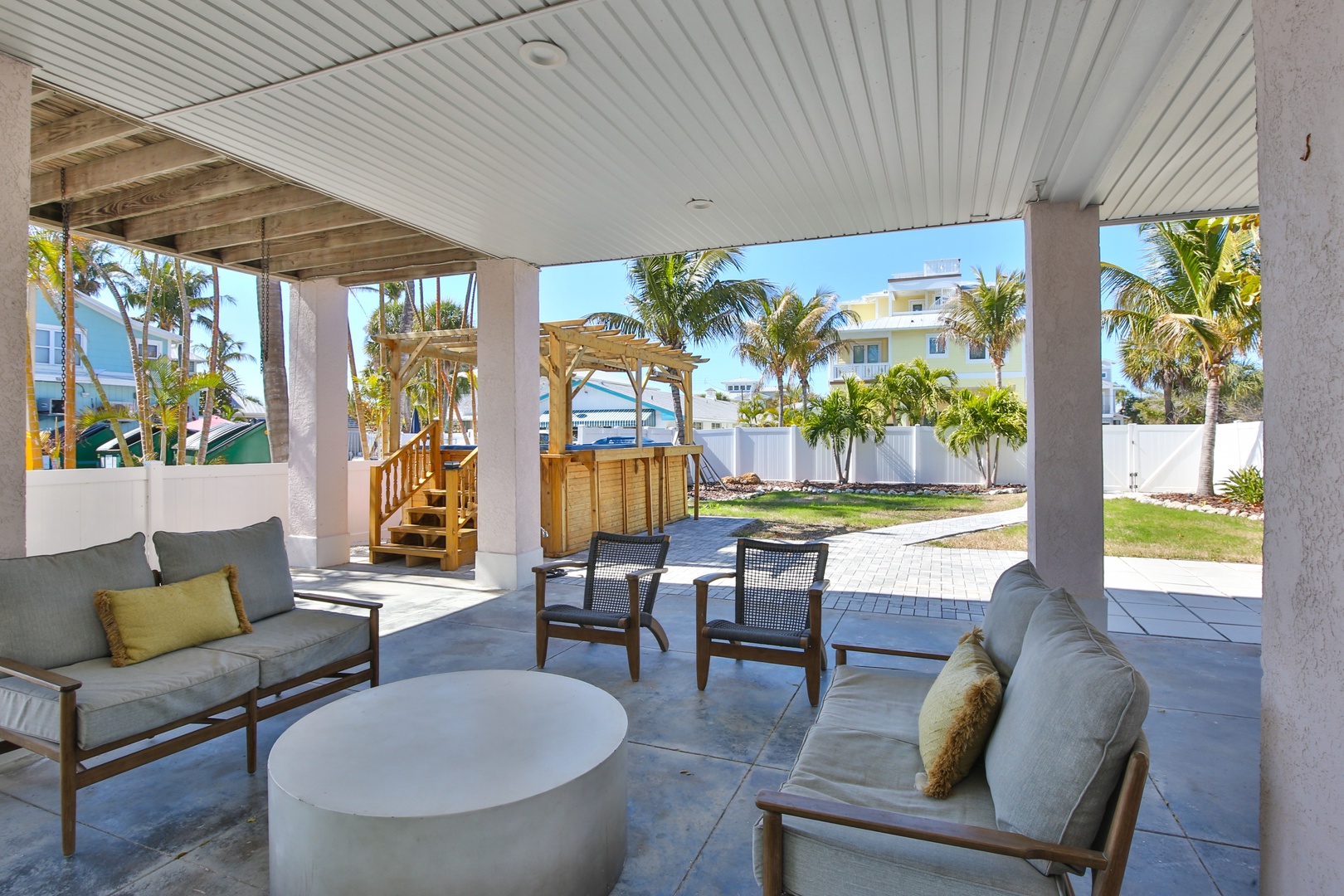 Relax in your covered patio's plush seating while enjoying tropical garden views and the warm island breeze.