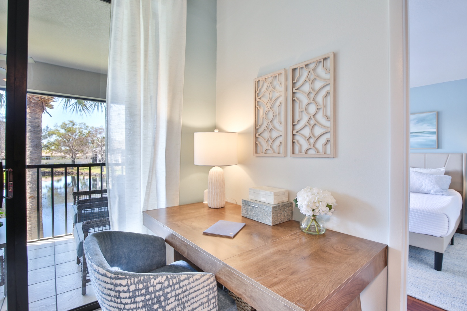 Settle into your elegant workspace with natural light streaming through palm-lined views while staying connected and productive.