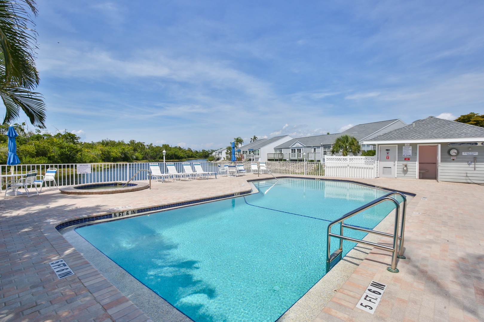 Dive into relaxation at your private pool oasis, where sparkling waters and sunny skies invite you to unwind. Lounge chairs await under swaying palms for your perfect poolside retreat.