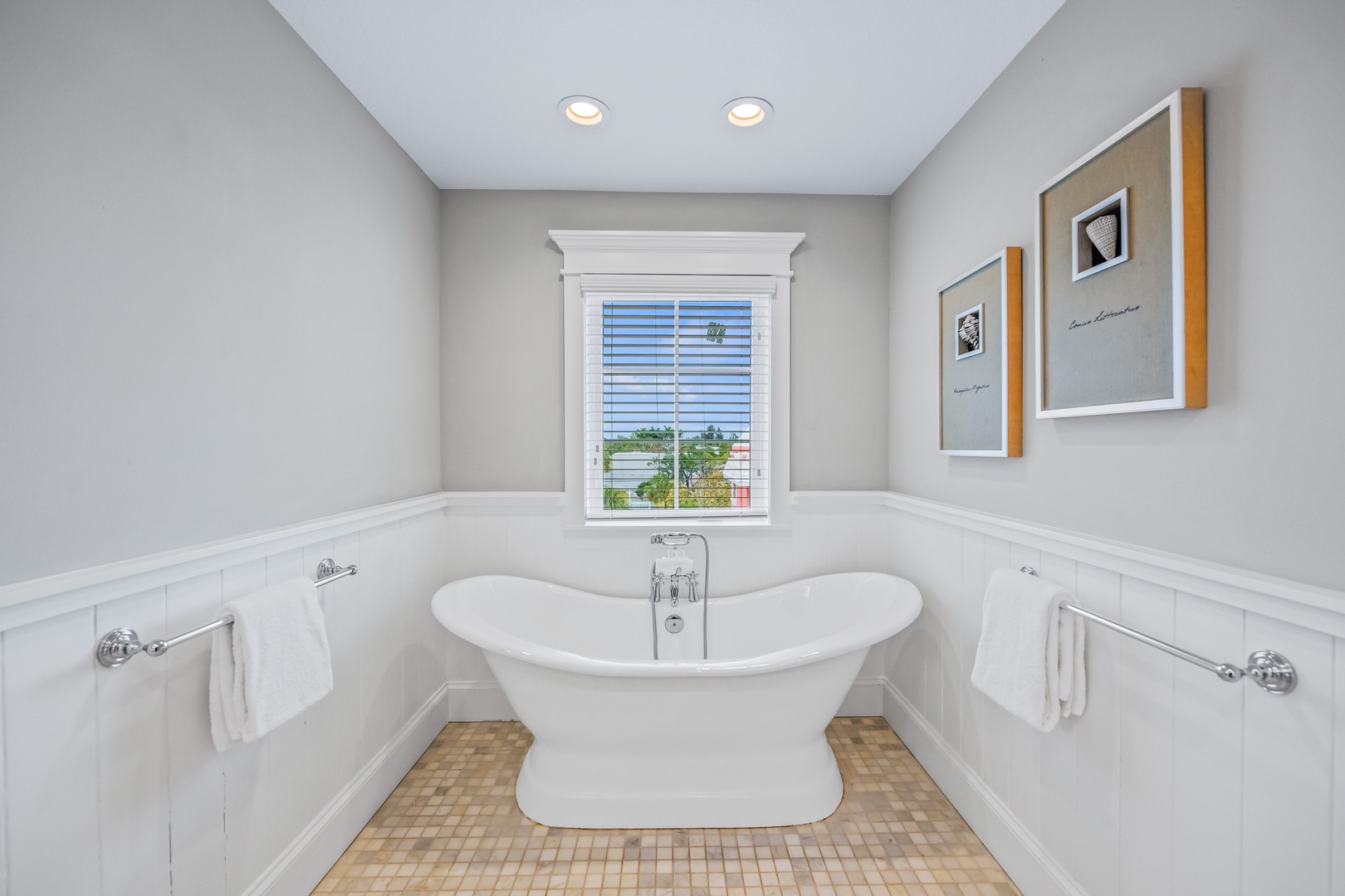 Sink into your private marble sanctuary with a luxurious freestanding tub perfect for unwinding after exploring.
