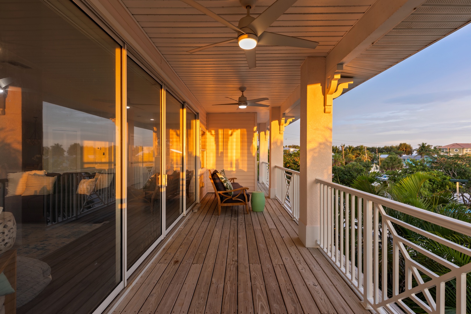Unwind on your private covered balcony with tropical views, perfect for morning coffee or evening relaxation.