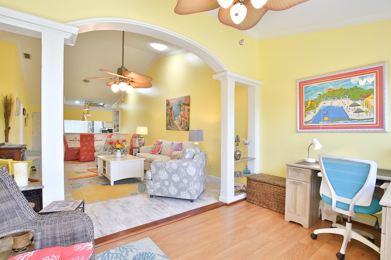 Bright, cheerful spaces flow together under tropical-style ceiling fans, offering you room to unwind, work, or gather with loved ones in this sunny retreat.
