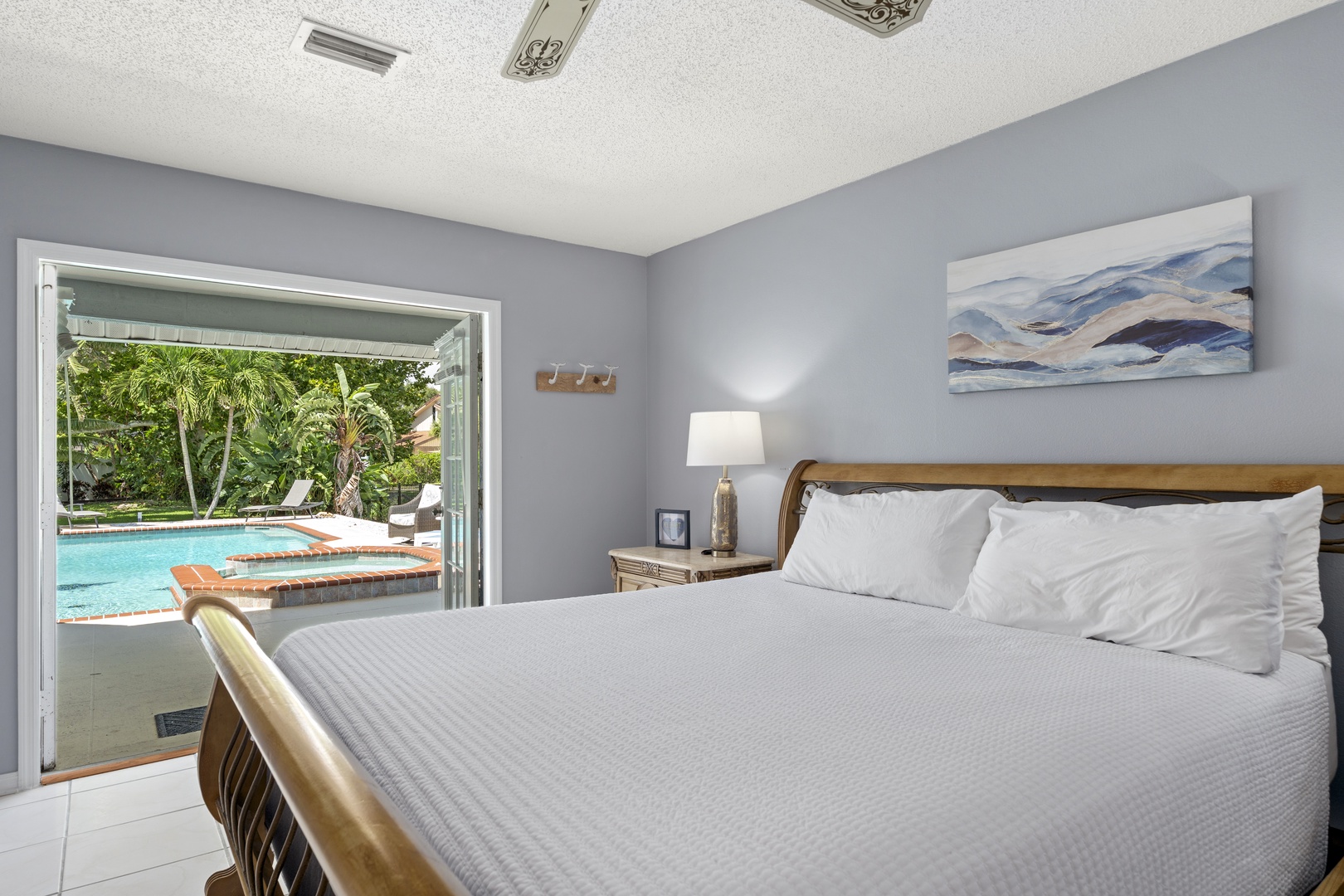Sink into soft linens while palm trees sway just outside your door. Step from your bed straight to the pool for morning swims or evening dips under the stars.