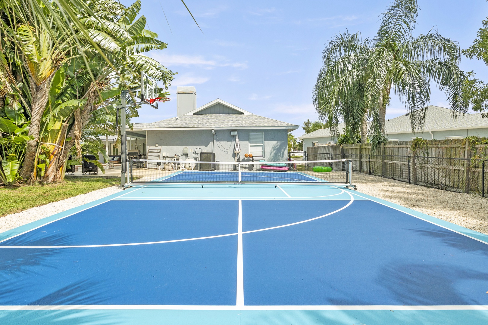 Challenge friends to a match on your private sport court, surrounded by lush tropical landscaping and just steps from the BBQ area—perfect for blending active fun with relaxation.