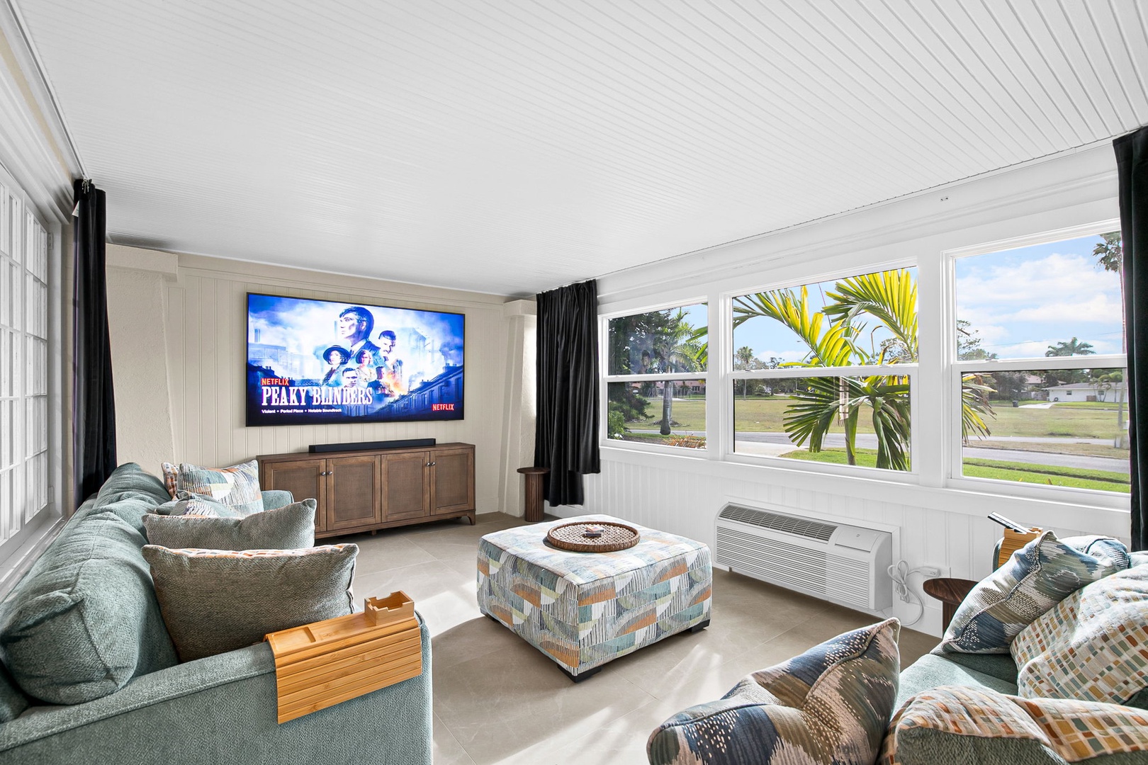 Sink into plush sofas and enjoy movie nights on the large flat-screen TV while tropical palms sway outside your windows.