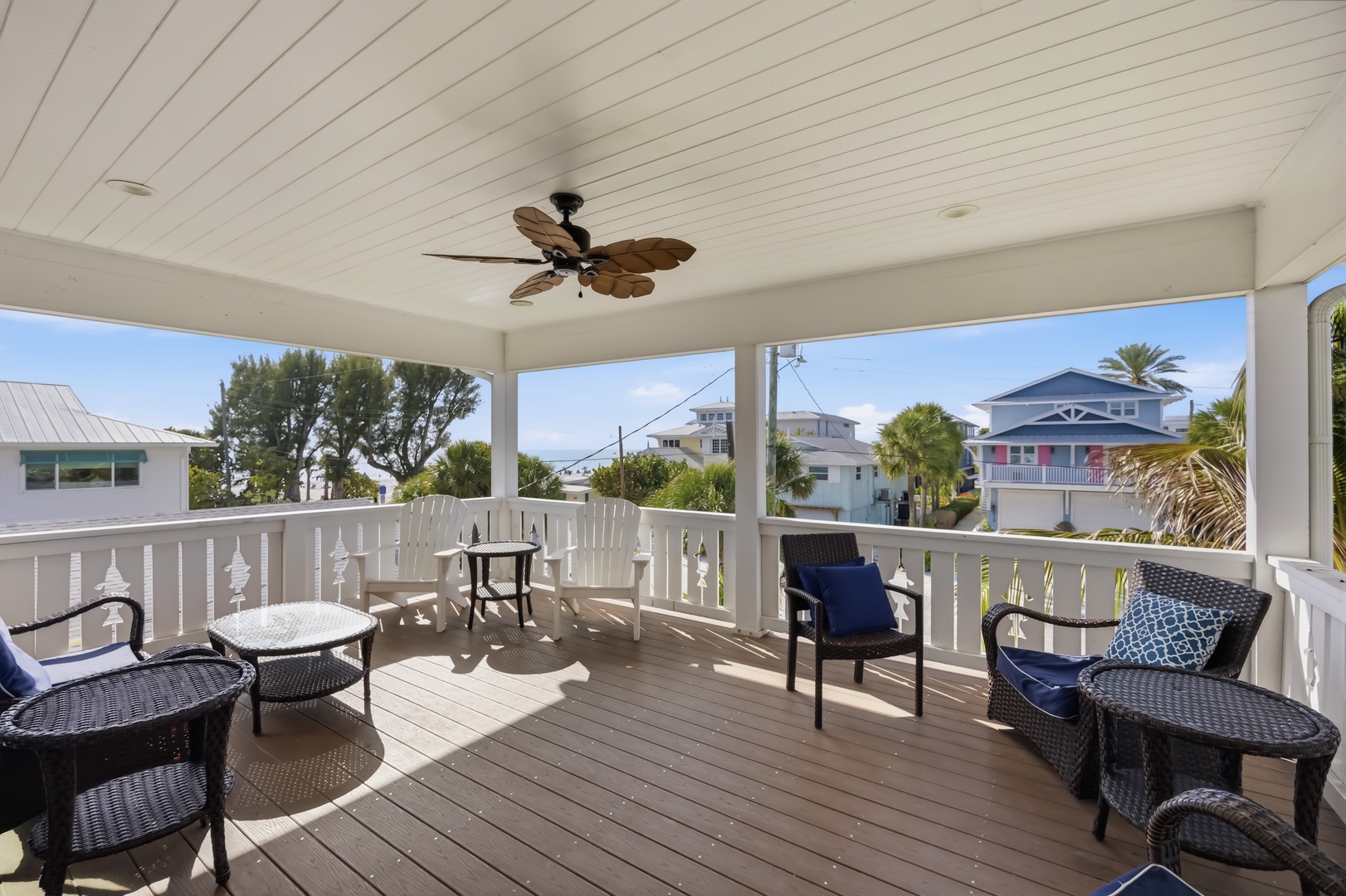 Relax on your private covered terrace with comfortable seating and coastal views.