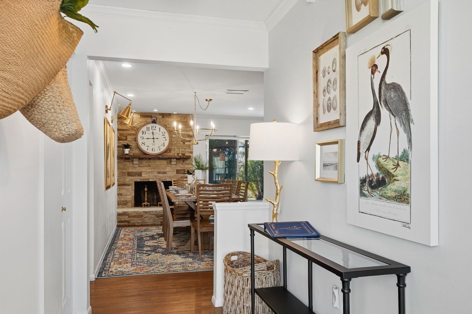 Step into your warm, beautifully curated home where thoughtful artwork and natural textures create an inviting atmosphere for memorable gatherings.