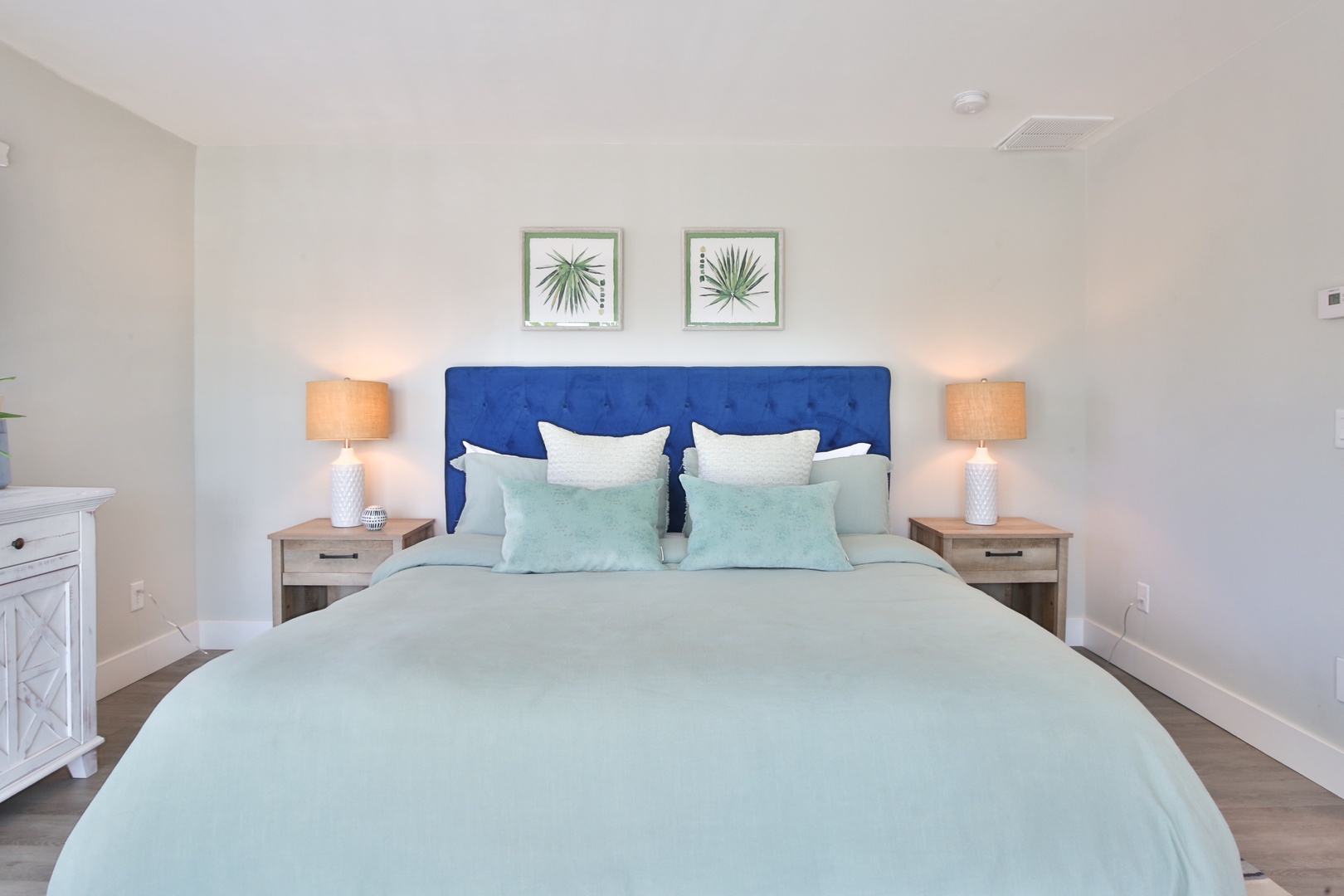 Drift into peaceful slumber in your serene bedroom, where soft mint linens and coastal decor create the perfect retreat for restful nights.