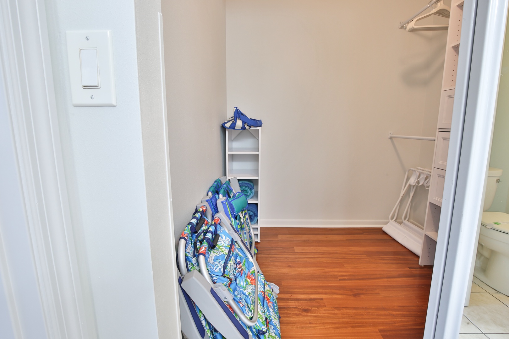 Your spacious walk-in closet offers plenty of room to organize your belongings with built-in shelving and hanging space.