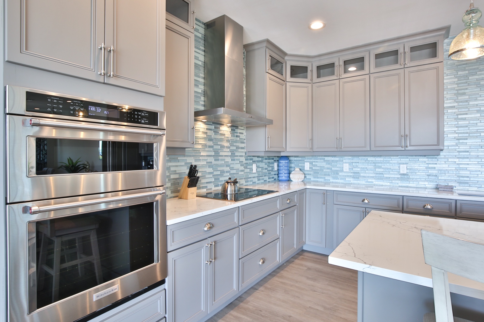 Cook your favorite meals in this elegant kitchen with granite countertops, stainless steel appliances, and beautiful tile backsplash.