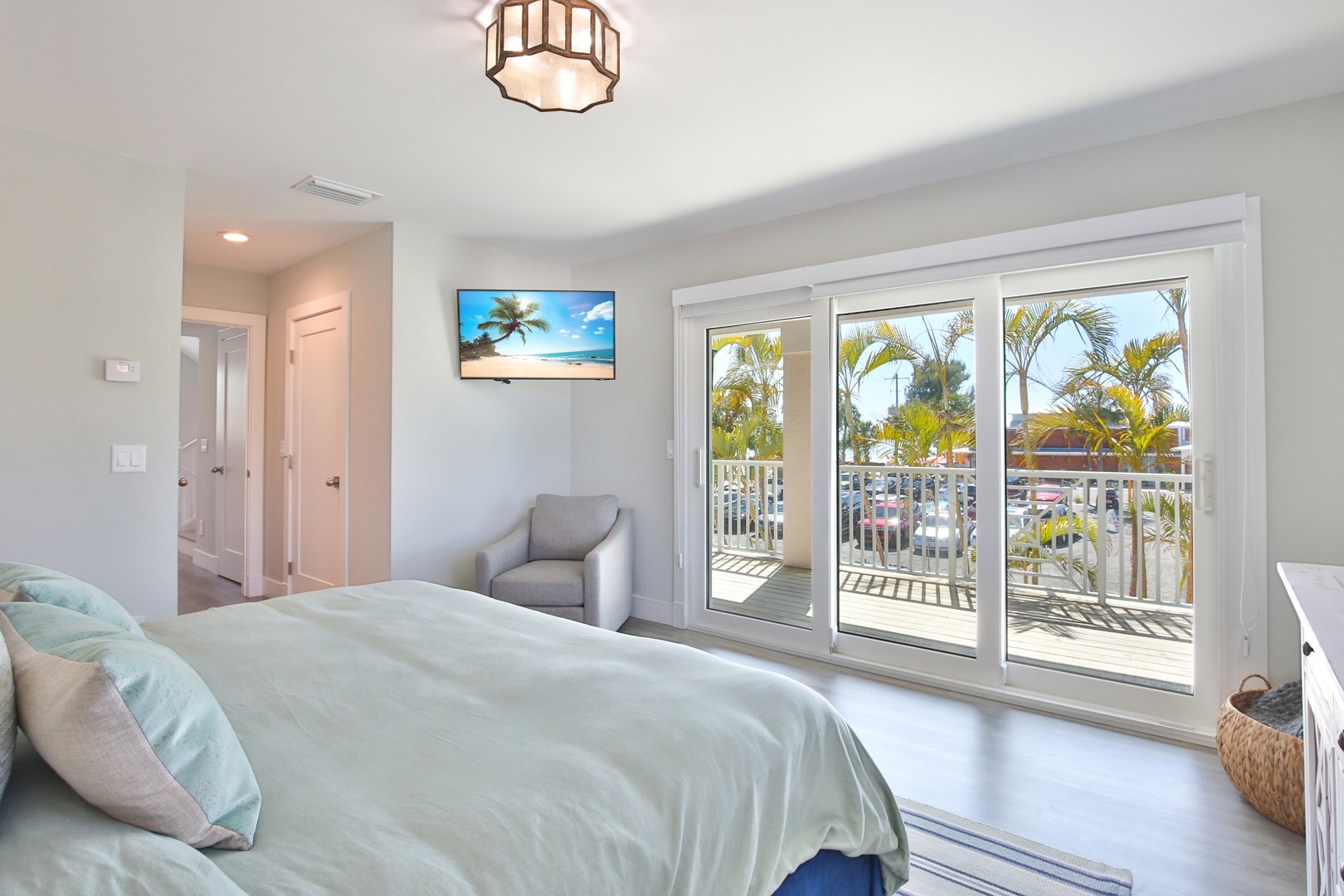 Wake up in your serene bedroom with tropical views just beyond your private balcony doors.