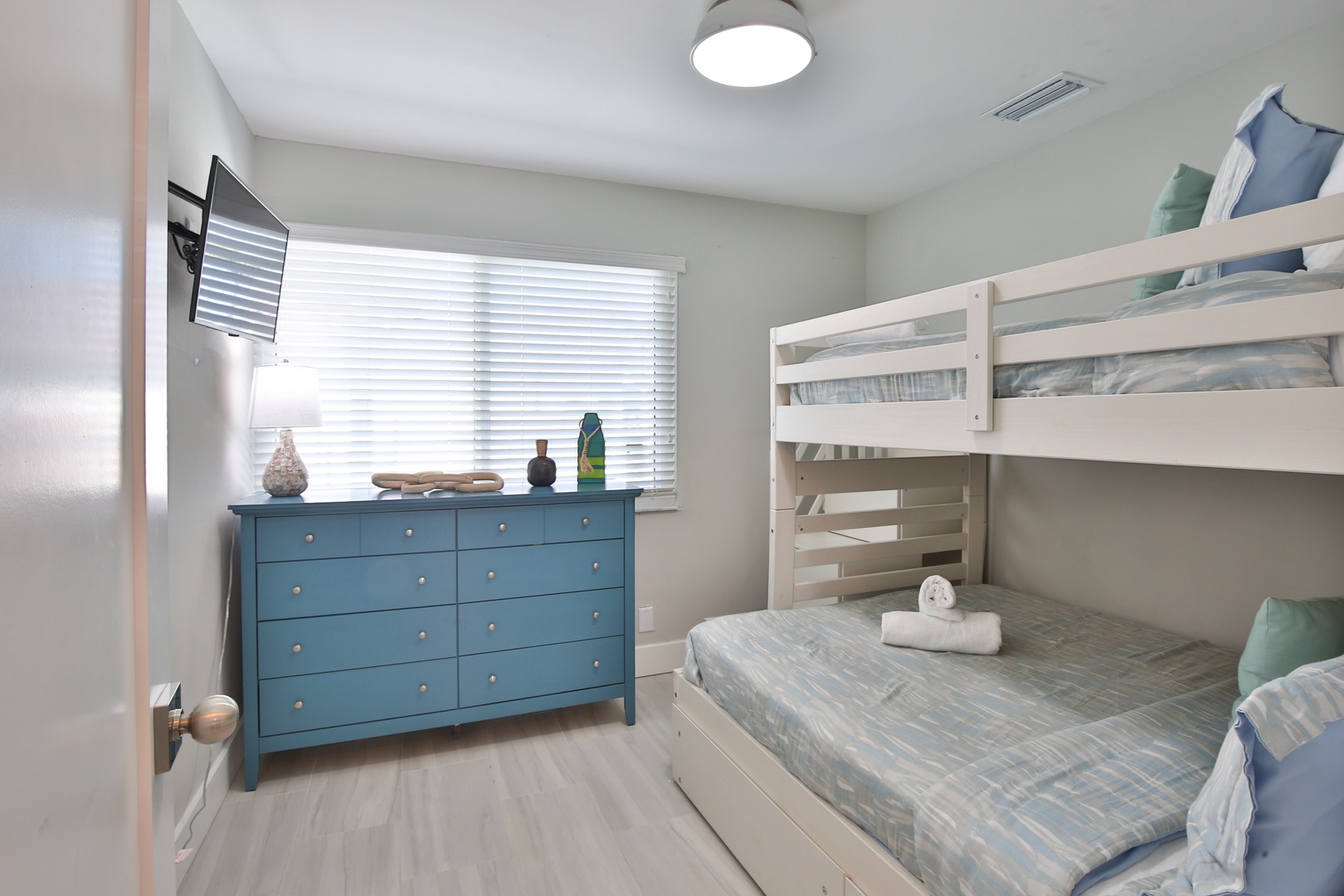 Your kids will love this bright bunk room with cozy beds, fresh linens, and plenty of storage space for their belongings.