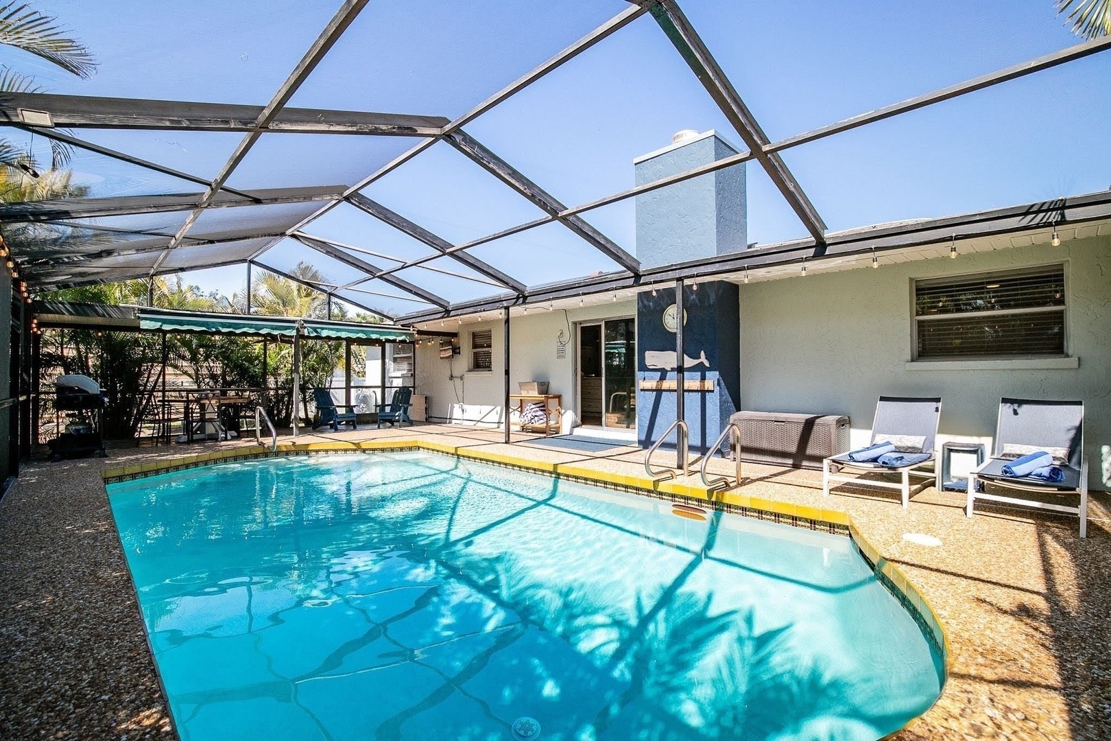 Dive into your private oasis with this enclosed pool area, perfect for year-round swimming and relaxation.