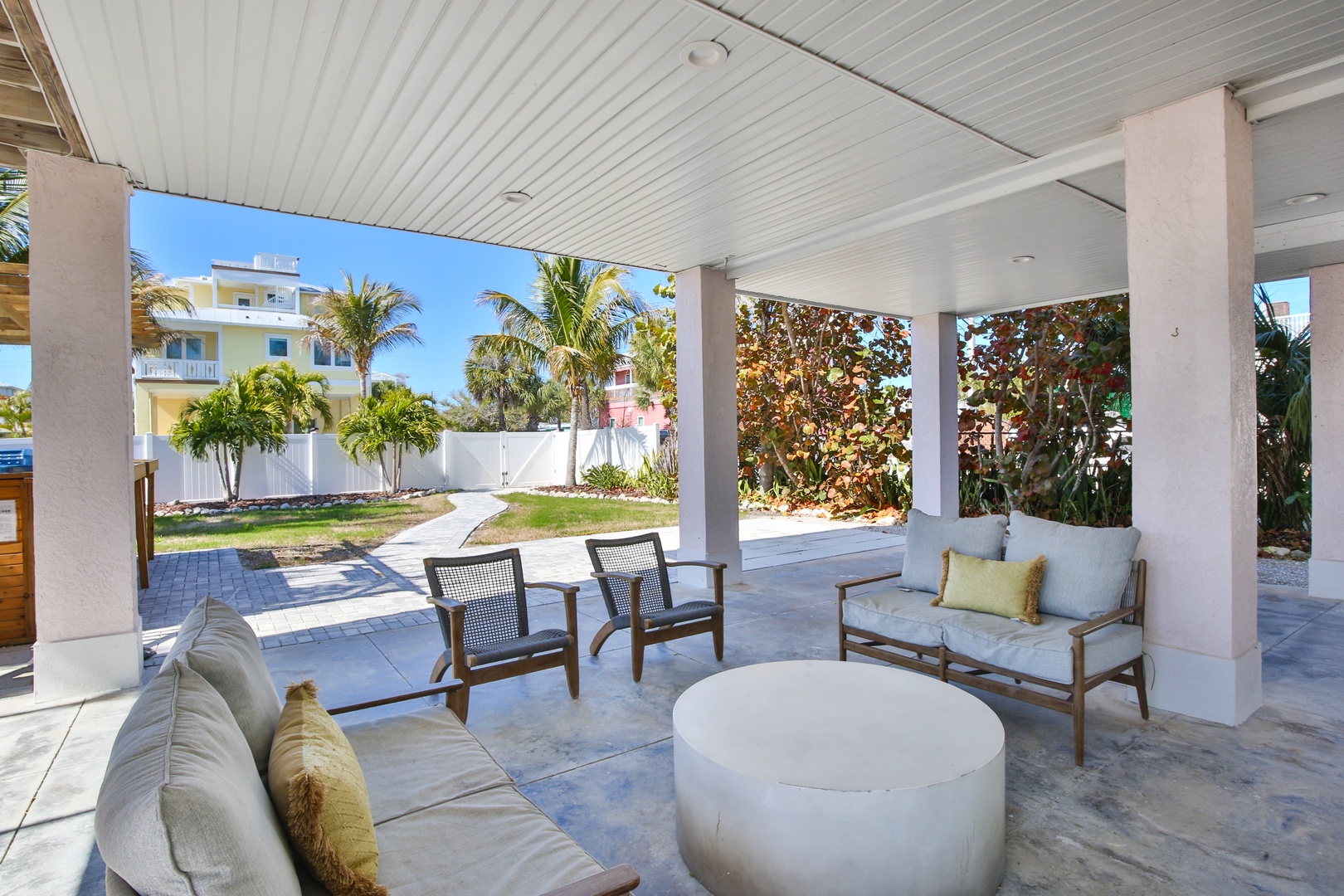 Relax in your private covered patio with tropical garden views. Stylish seating creates the perfect spot for morning coffee or sunset cocktails.