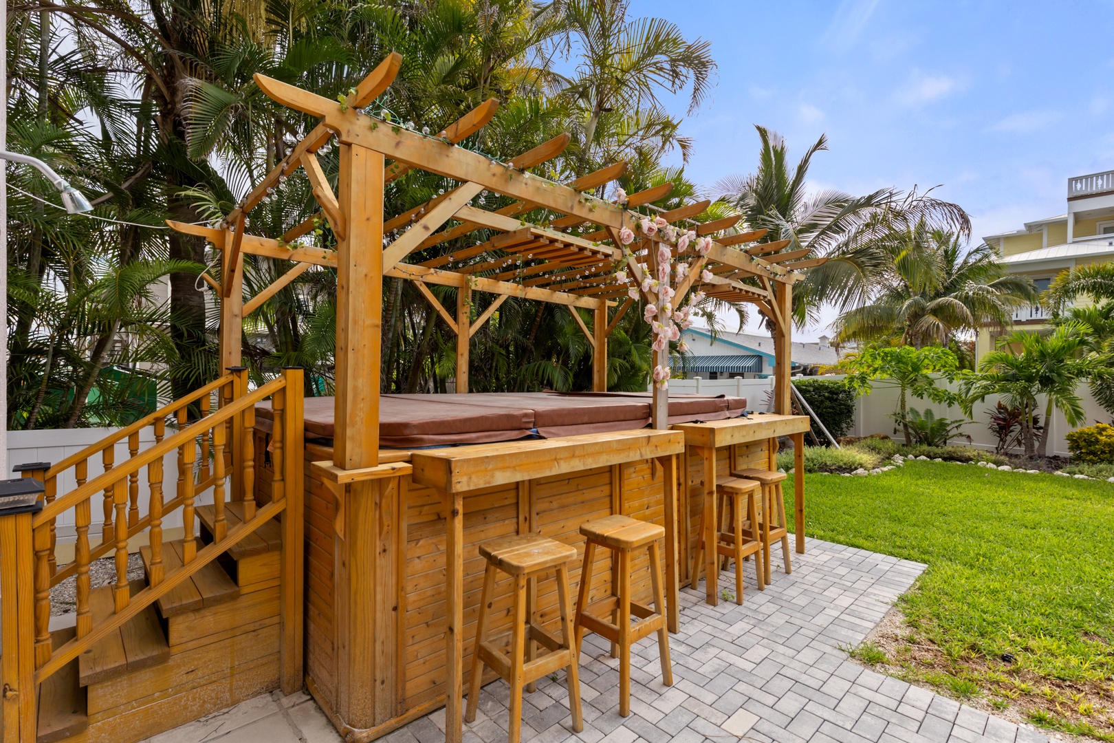 Your private tiki bar awaits in this tropical paradise, perfect for sunset cocktails surrounded by swaying palms.