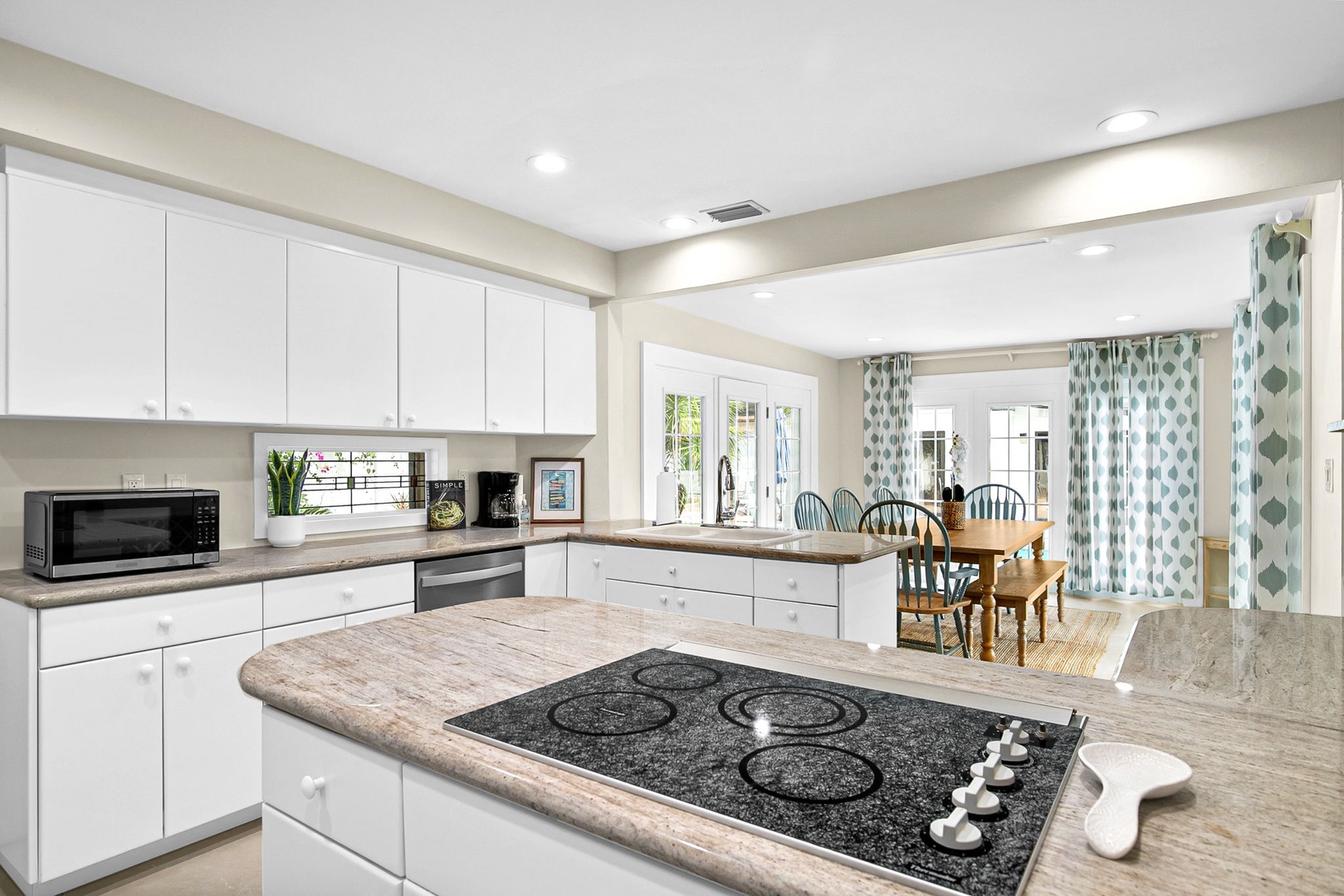 Cook your favorite meals in this bright, spacious kitchen featuring modern appliances and ample counter space for all your culinary adventures.