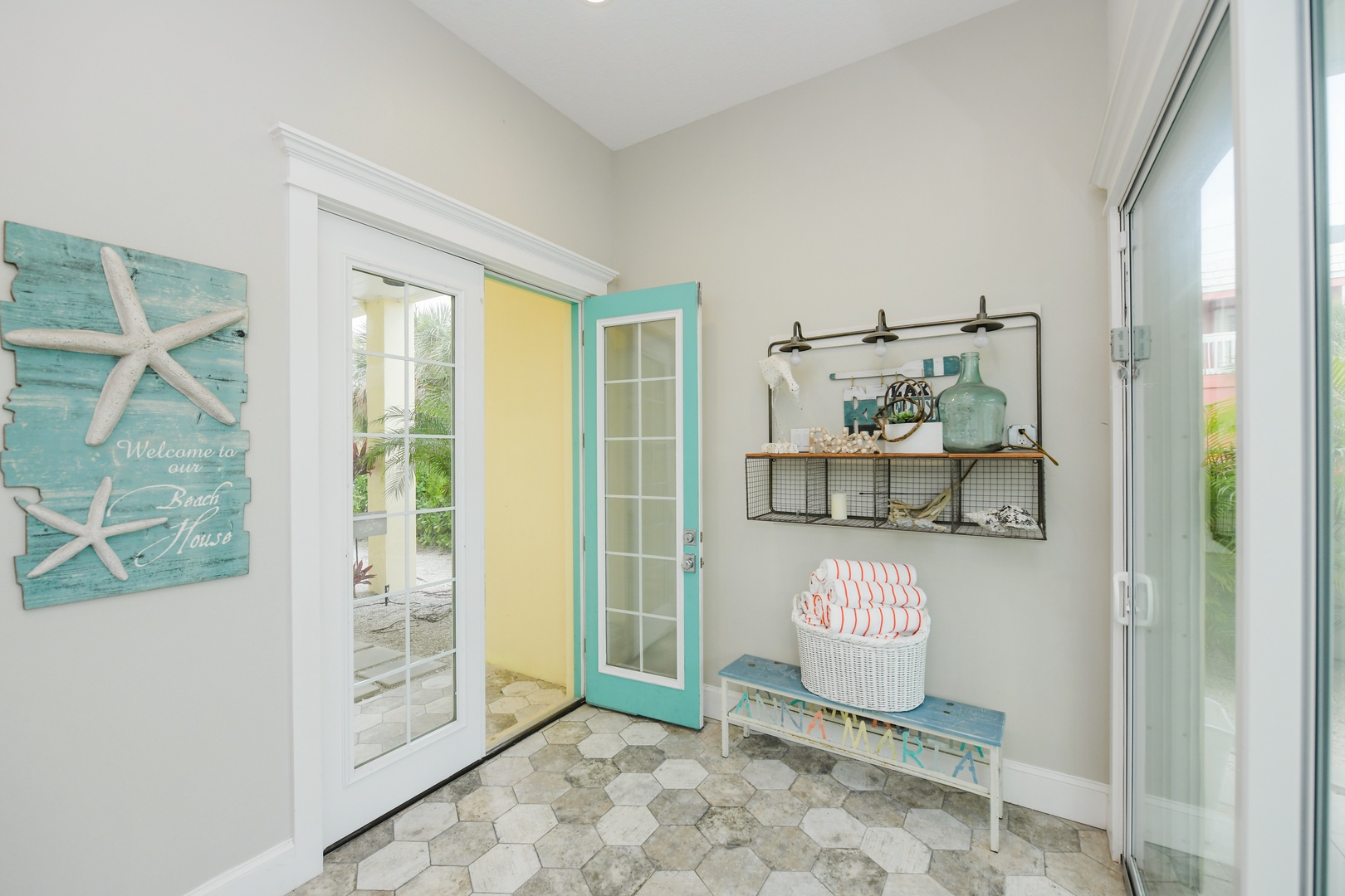 Step into your charming beach house entryway where coastal décor and thoughtful touches welcome you home after sun-soaked adventures.