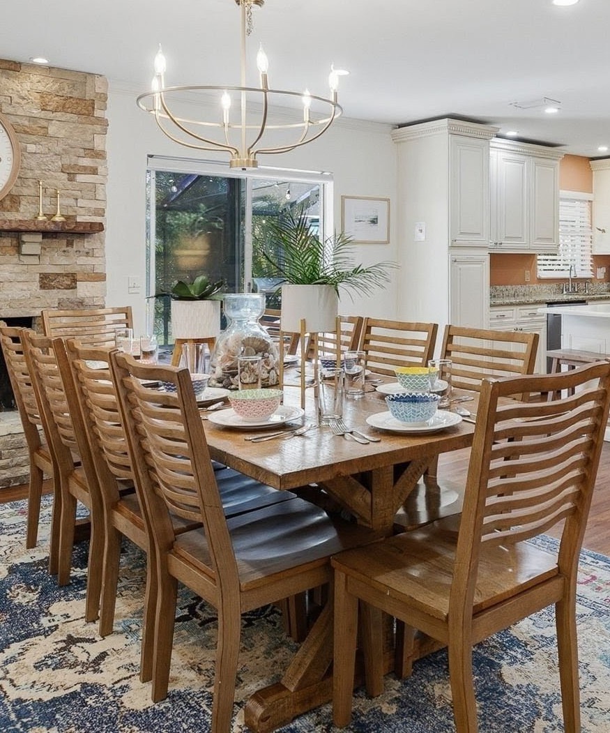 Gather around this beautiful dining table where memorable meals await your group in this open, light-filled space.