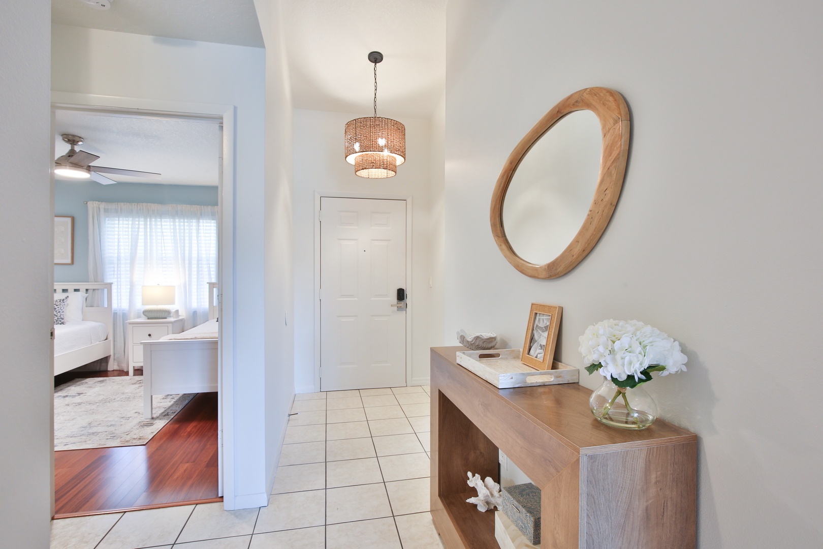 Step into your welcoming entryway with warm wood accents and thoughtful touches that make you feel right at home.