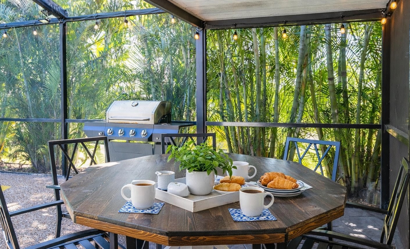 Start your morning with coffee and pastries in this glass-enclosed patio, where tropical bamboo creates your private breakfast sanctuary.