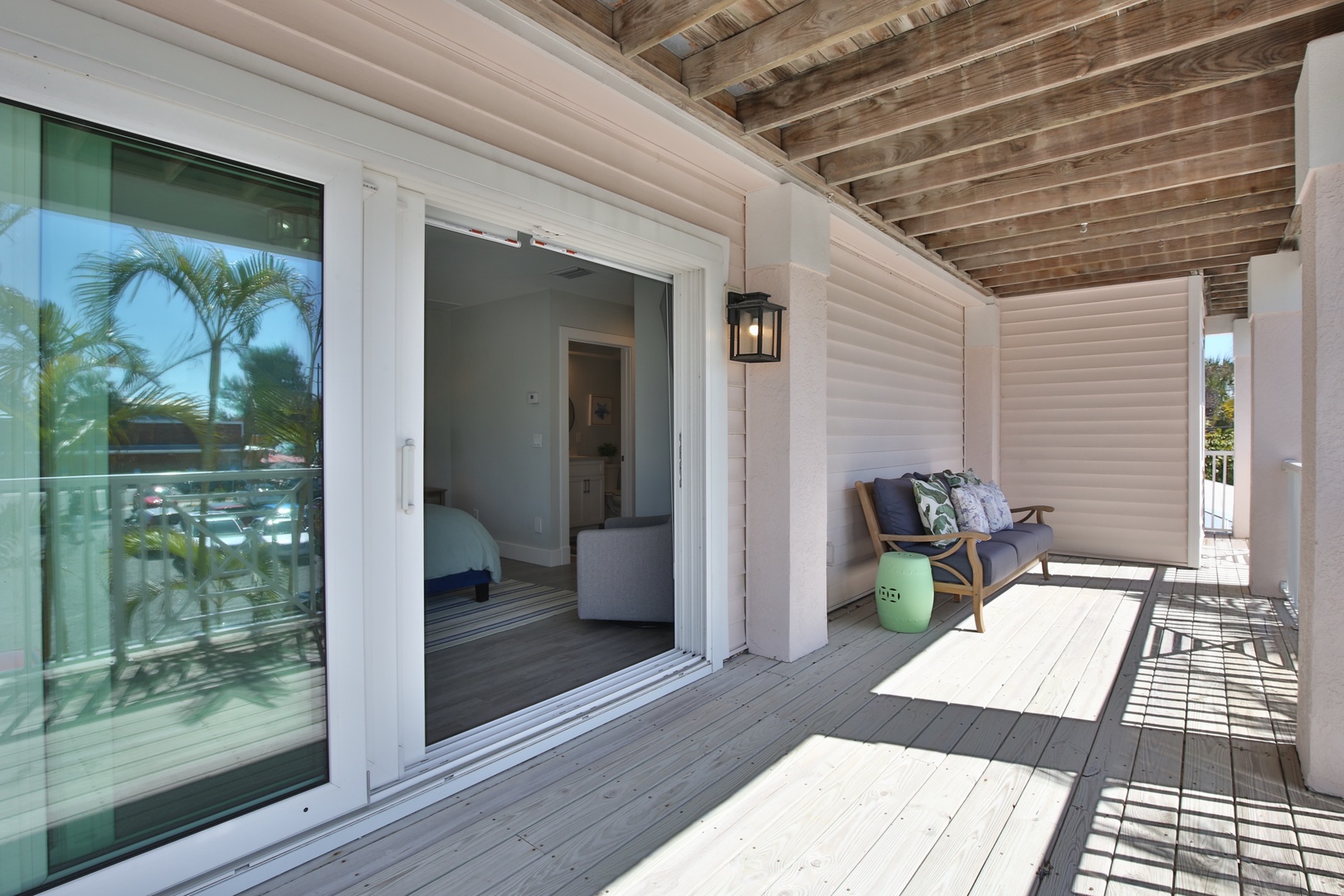 Step onto your private terrace where coastal comfort meets modern style, featuring cozy seating and seamless indoor-outdoor living.