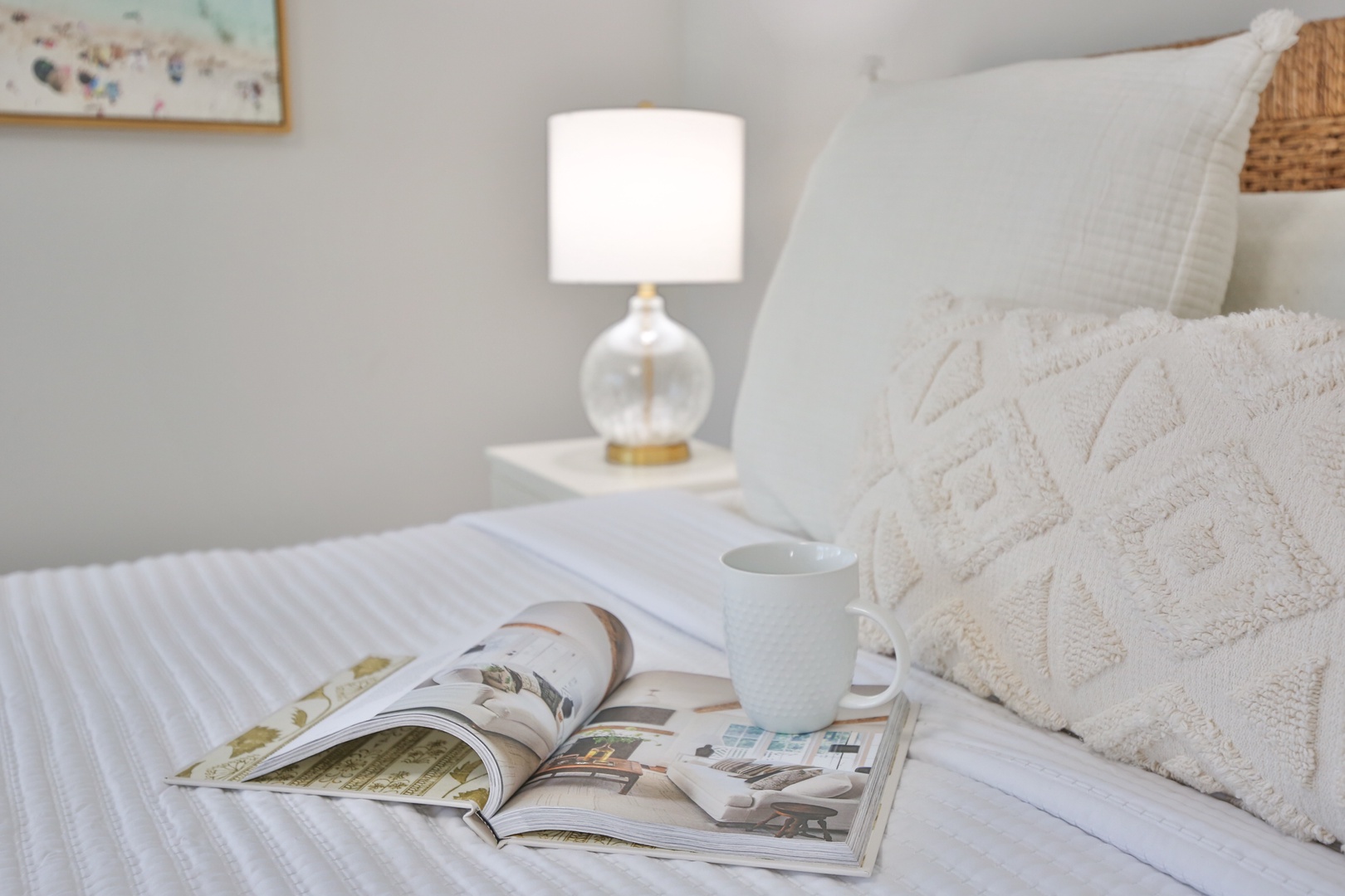 Sink into crisp white linens with your morning coffee and favorite magazine beside the warm glow of bedside lighting.