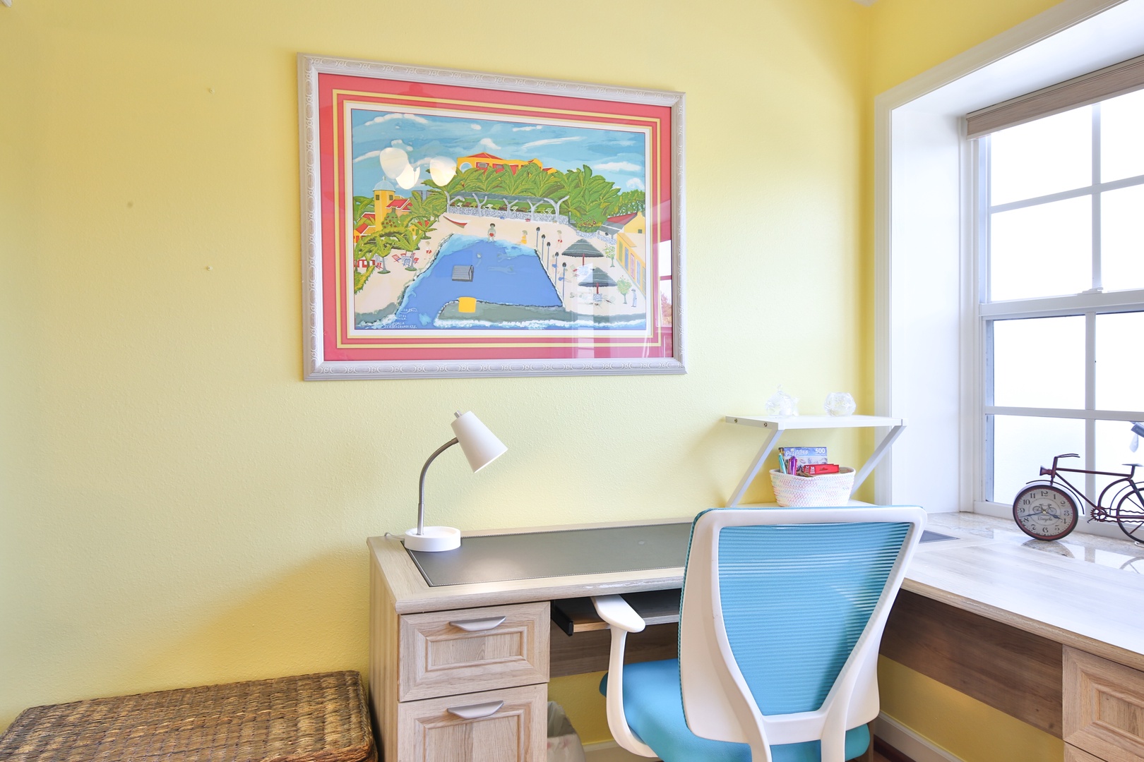 Settle into your private workspace, where warm yellow walls and abundant natural light create a cheerful spot for planning your next adventure or catching up on emails.
