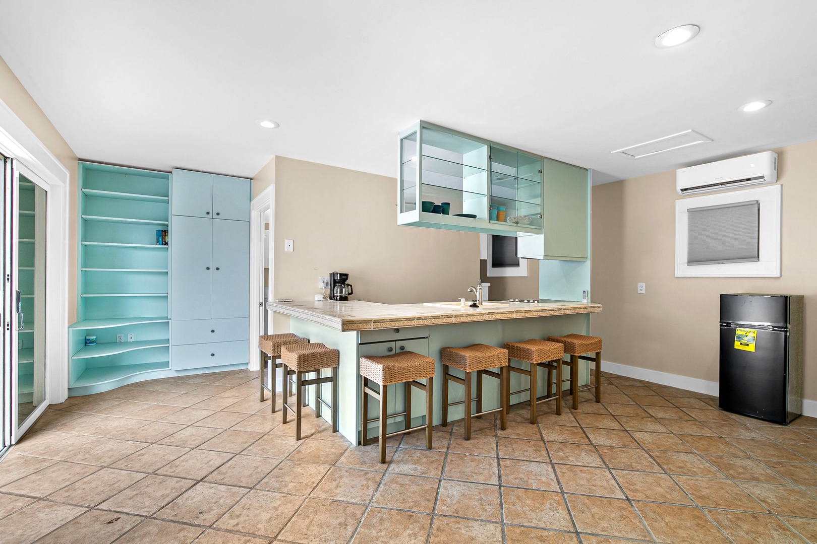 Your spacious kitchen features modern appliances and a breakfast bar where you can gather with friends over morning coffee.